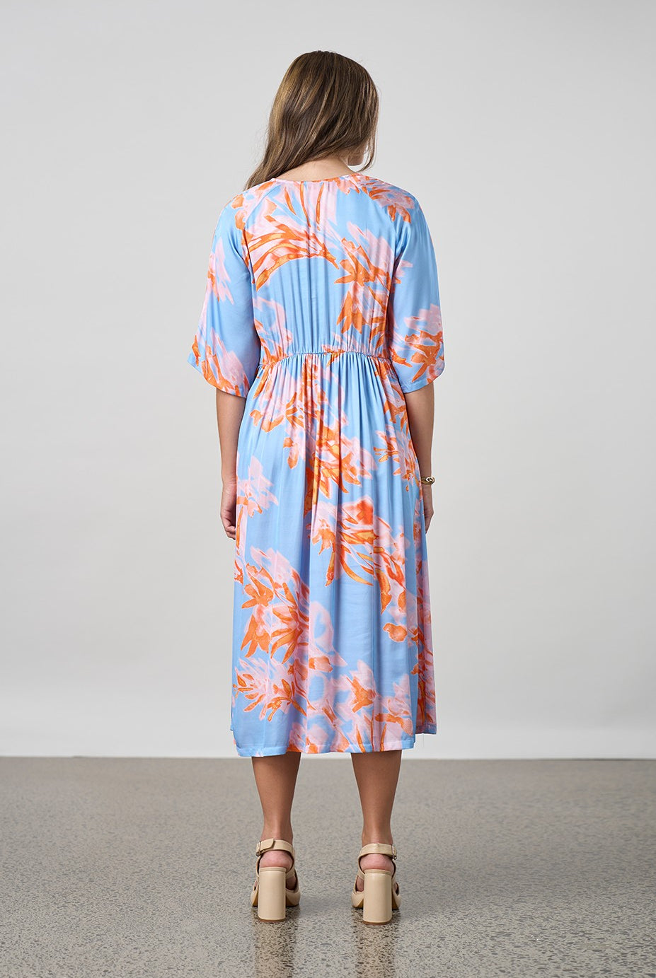 sky blue with coral floral midi dress worn by model back view