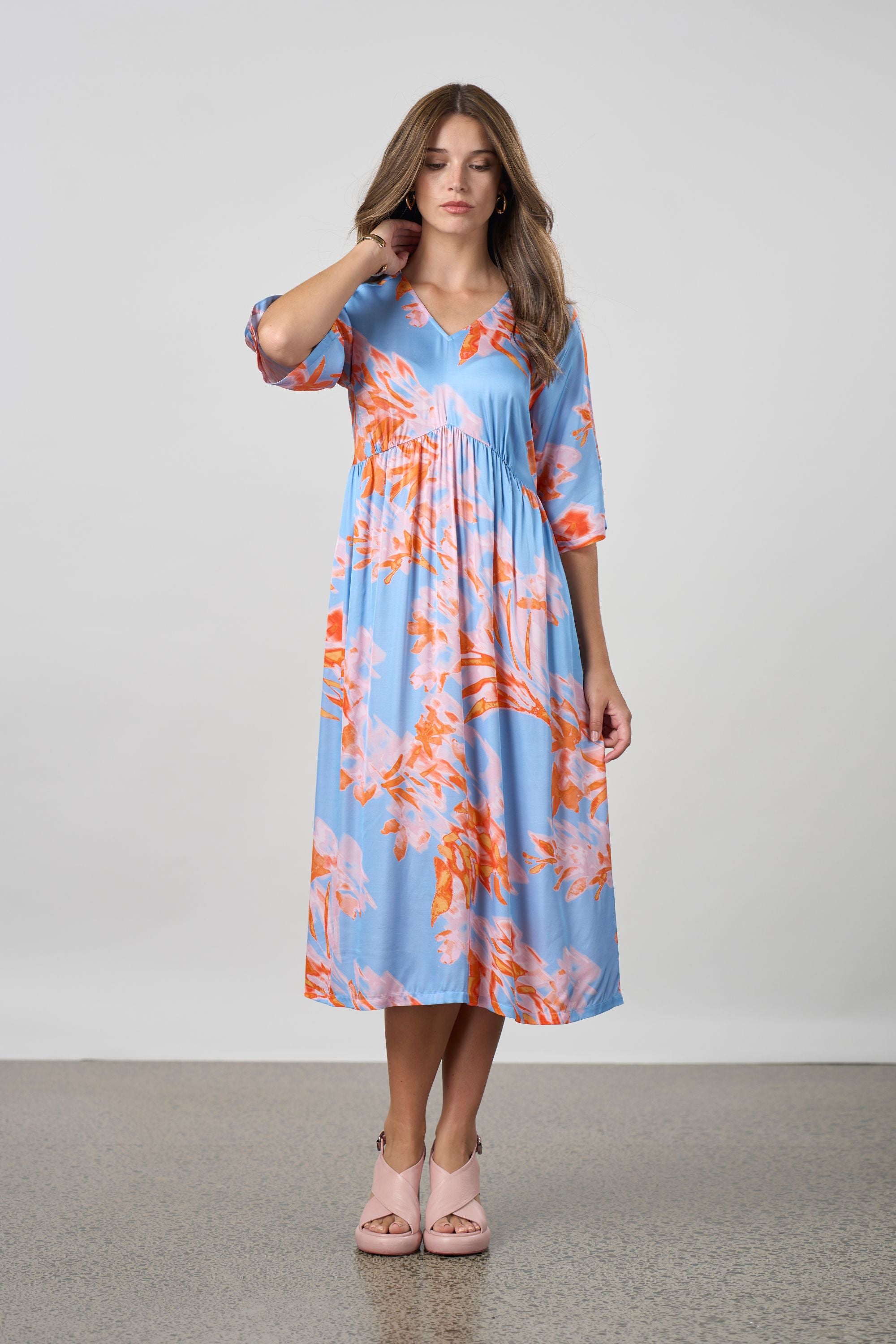 sky blue with coral floral midi dress worn by model