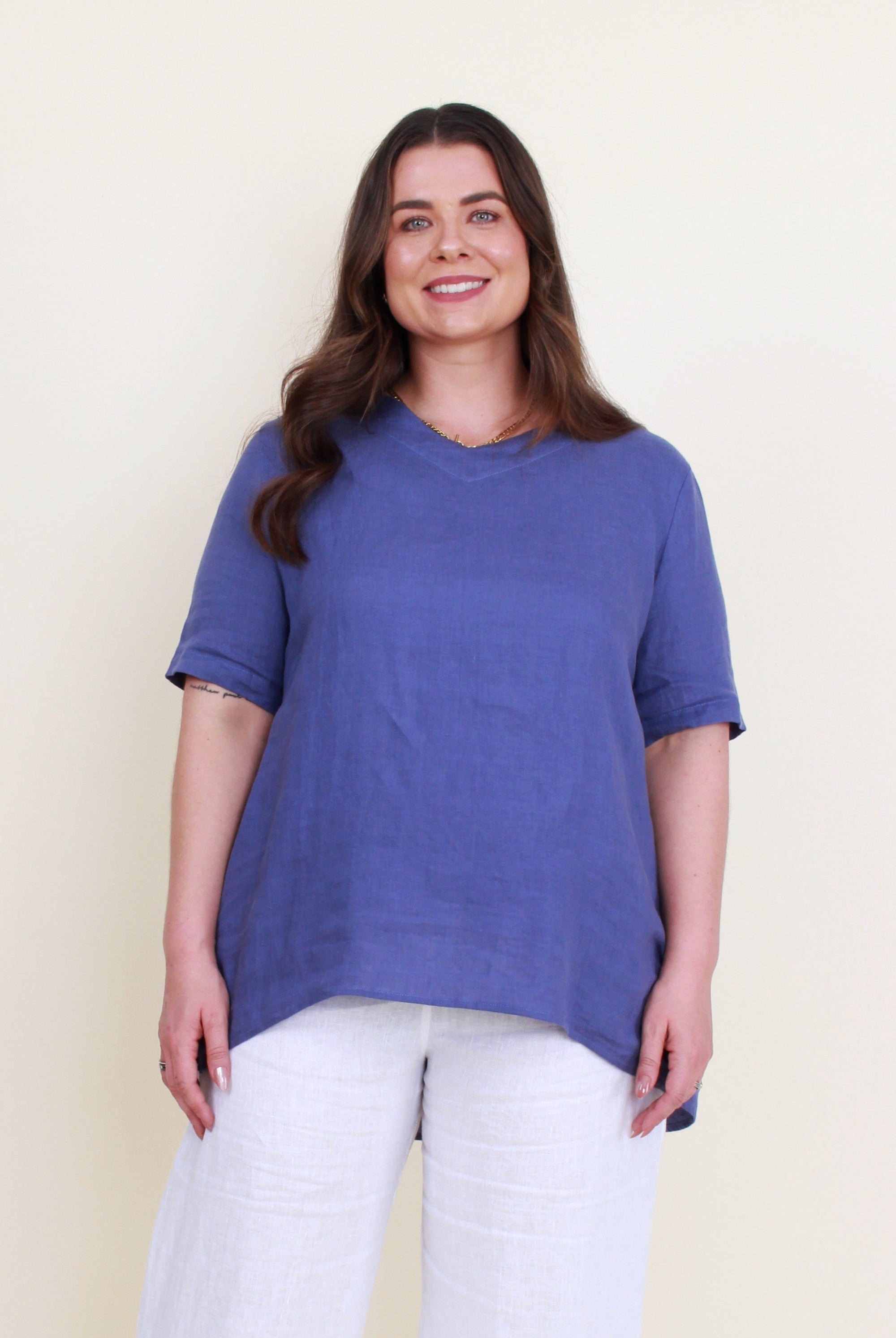 women curve hem linen top in denim worn by model