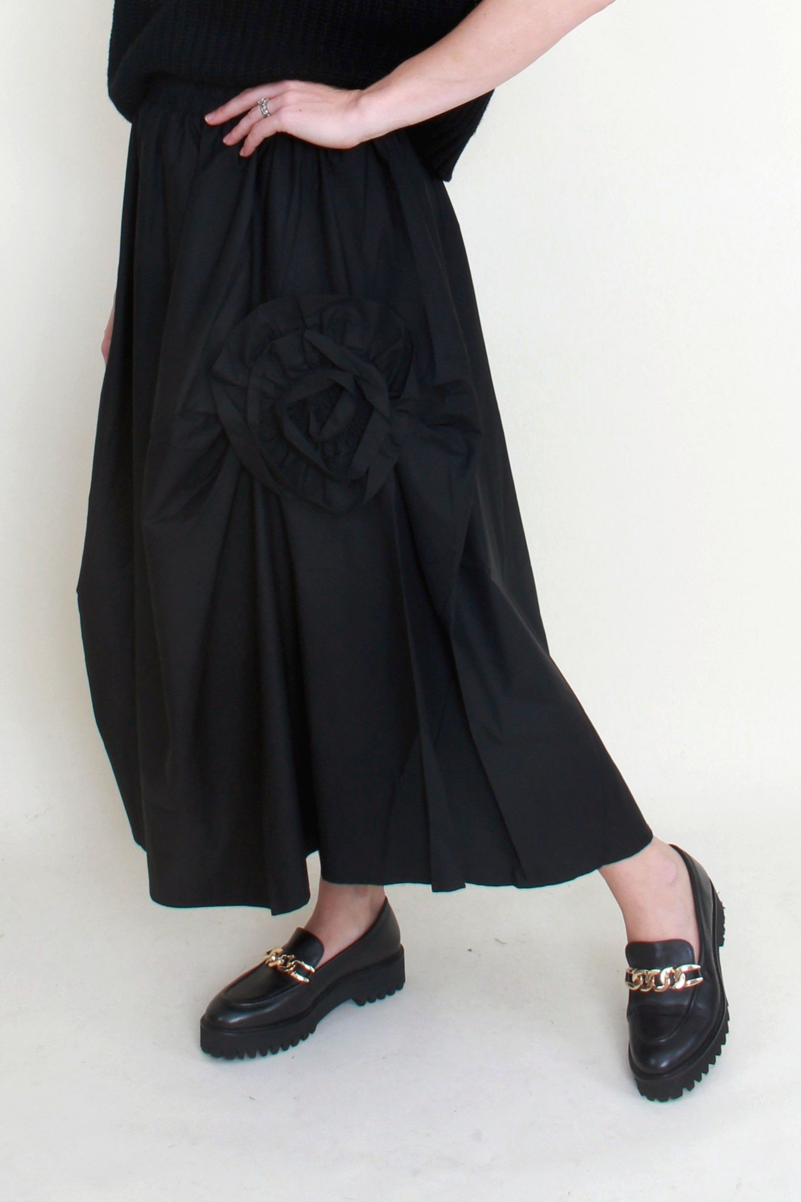 black maxi skirt rosette detail worn by model