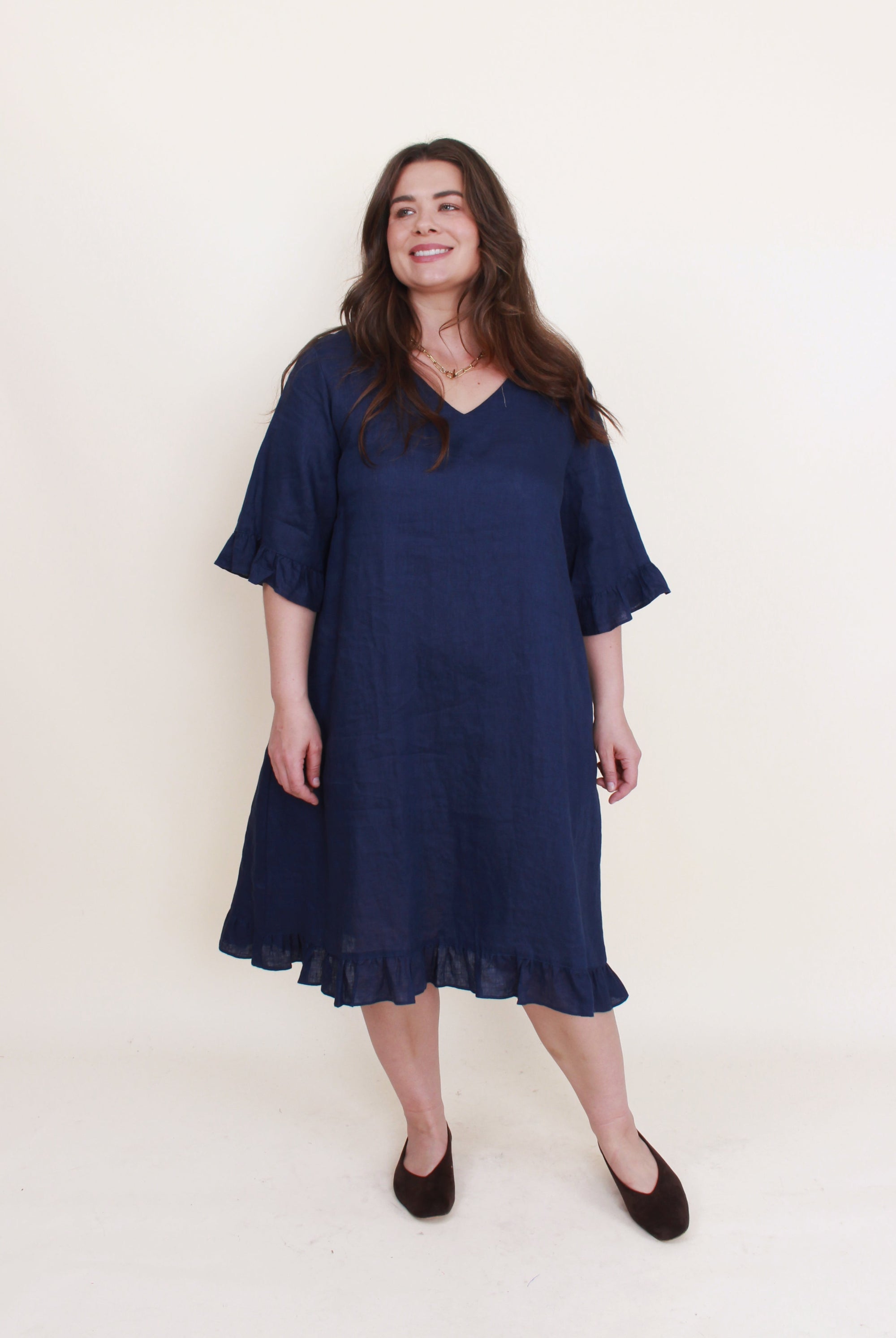 navy ruffle hem linen midi dress worn by model
