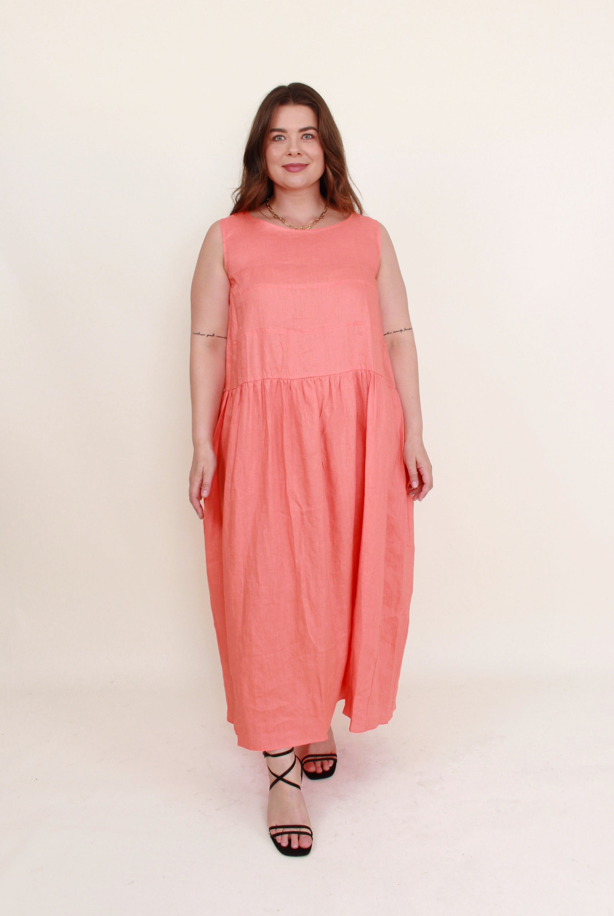 sleeveless linen midi dress persimmon coral worn by model