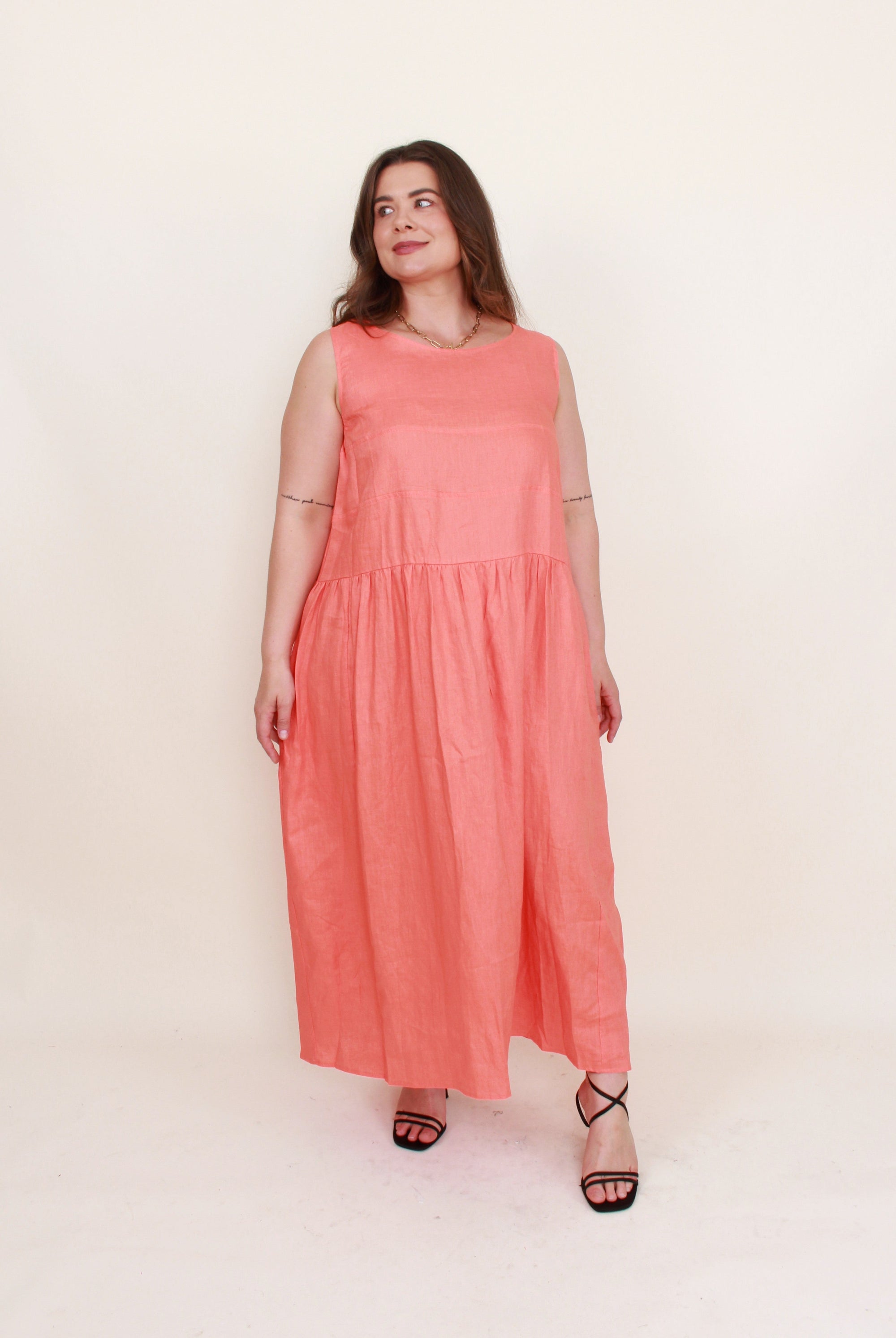 sleeveless linen midi dress persimmon coral worn by model