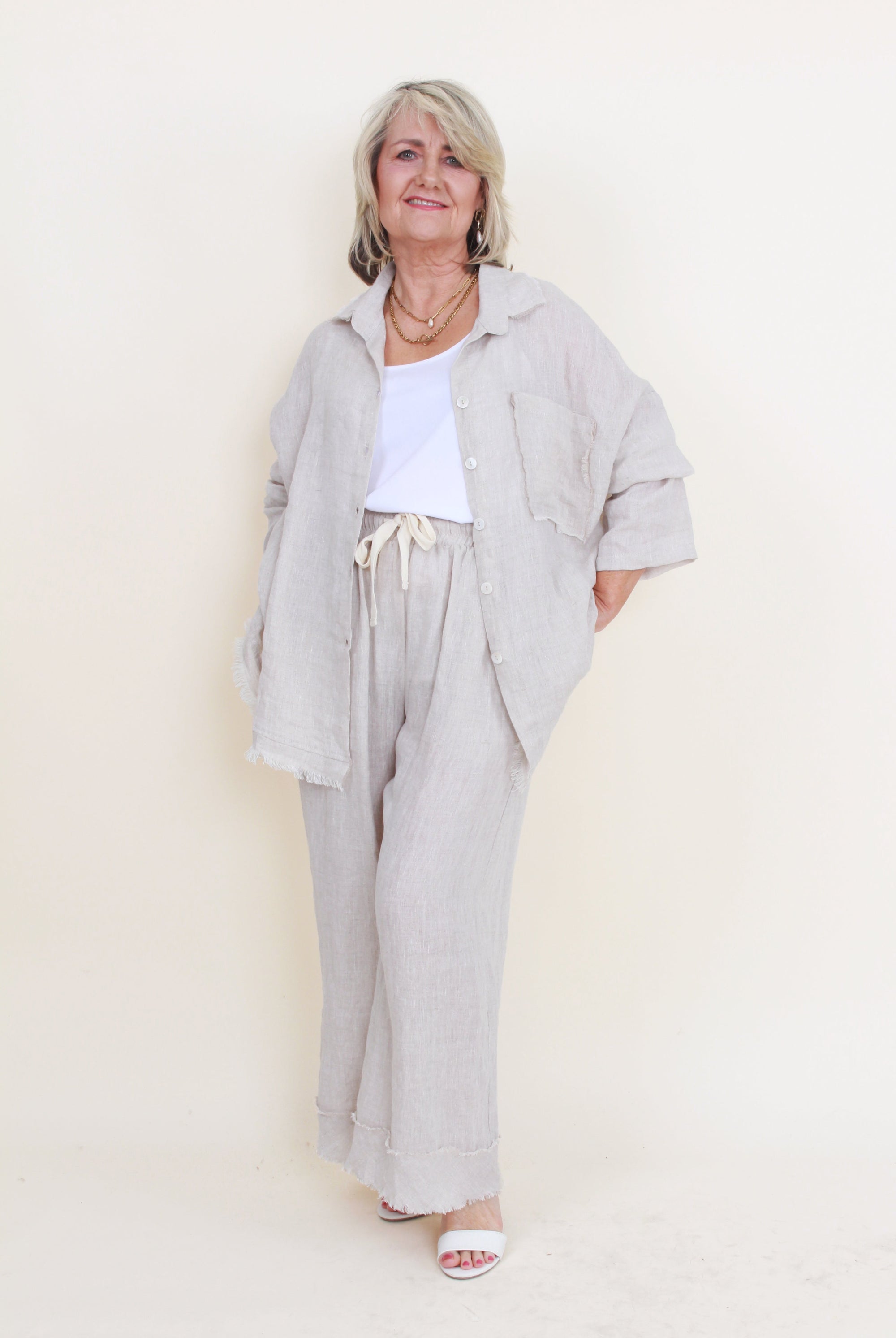 womens relaxed wide leg pants with frayed hem colour sand on model