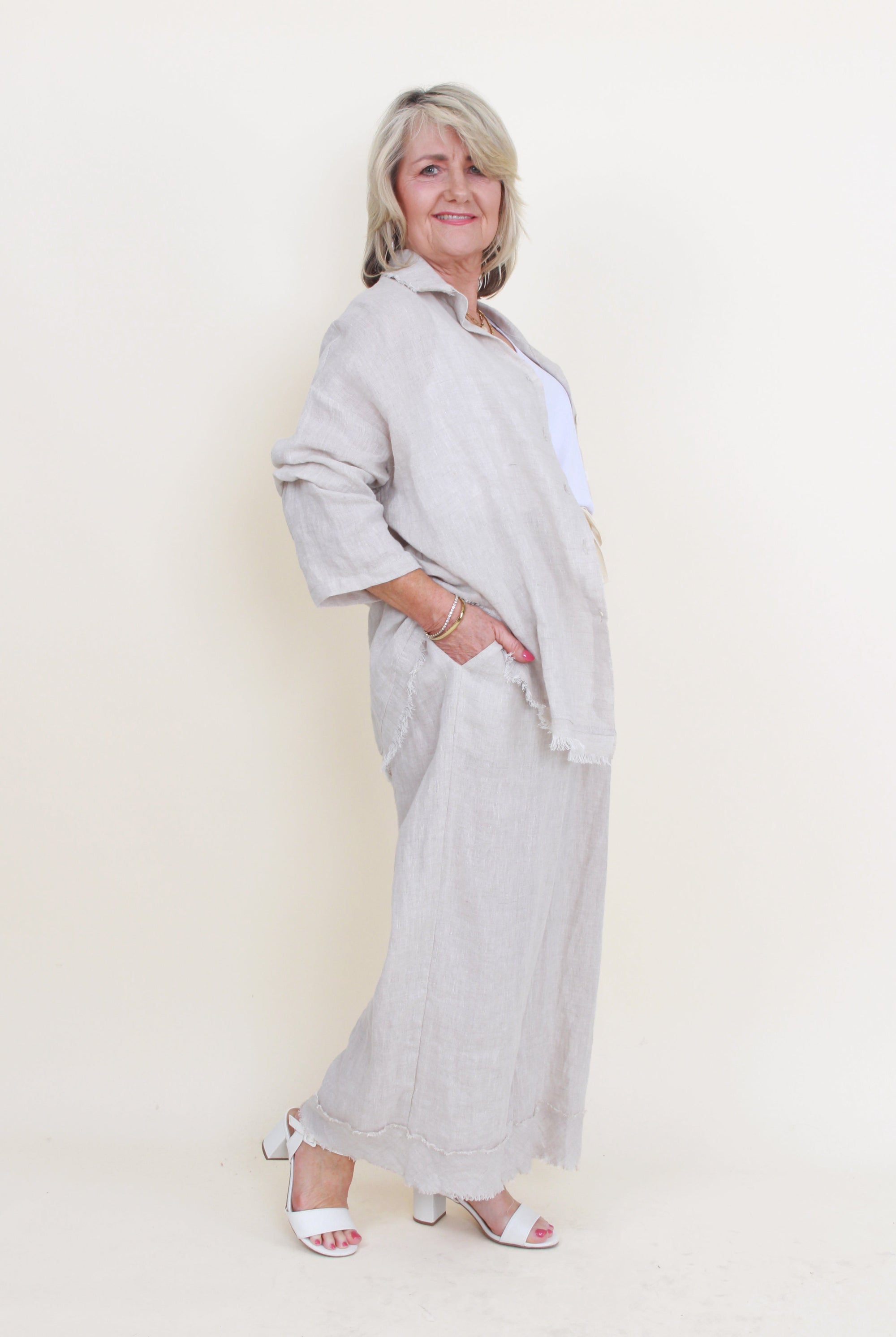 wmones wide leg fray hem pants and matching shirt colour sand on model