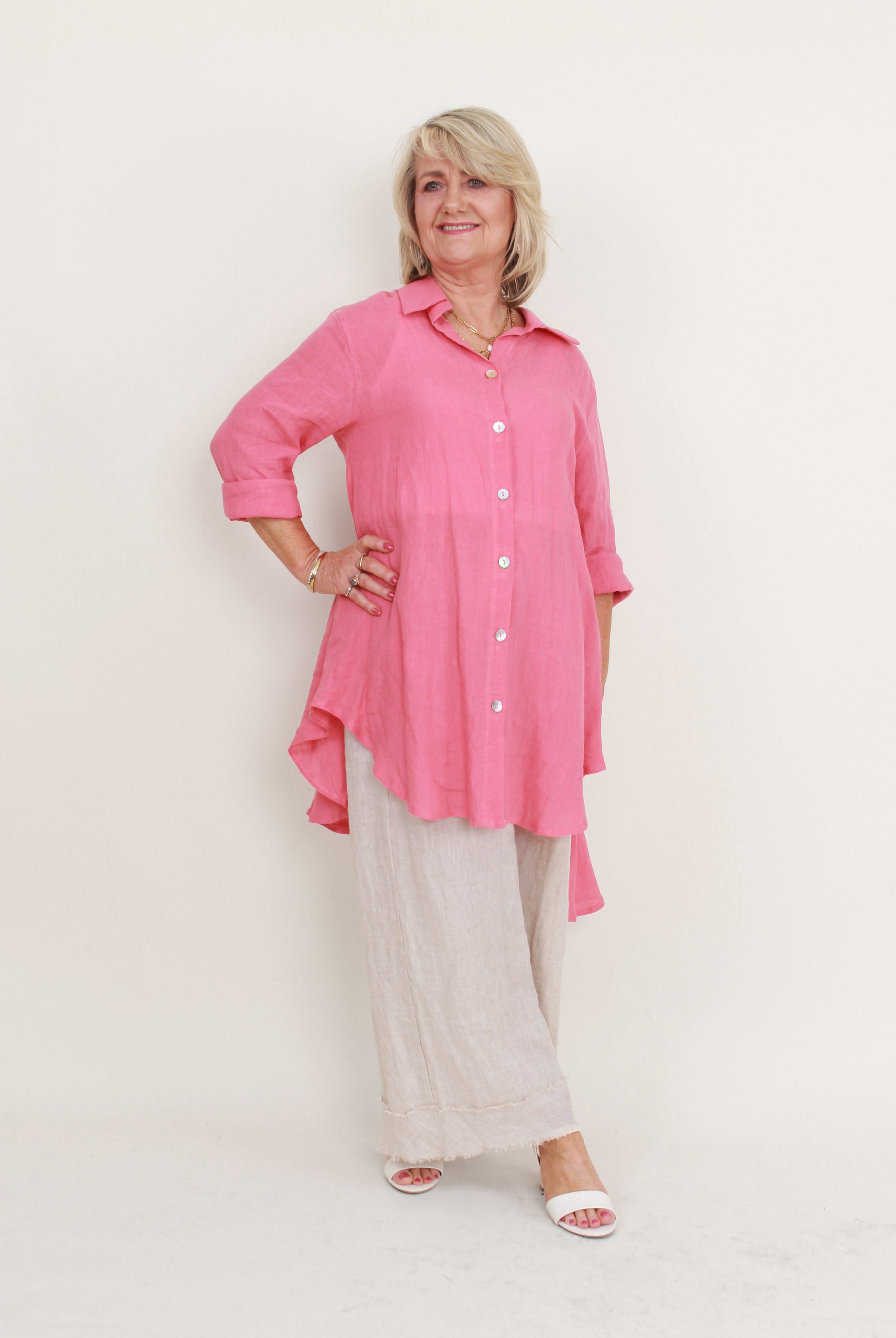 womens high low swing button through top in melon worn by model