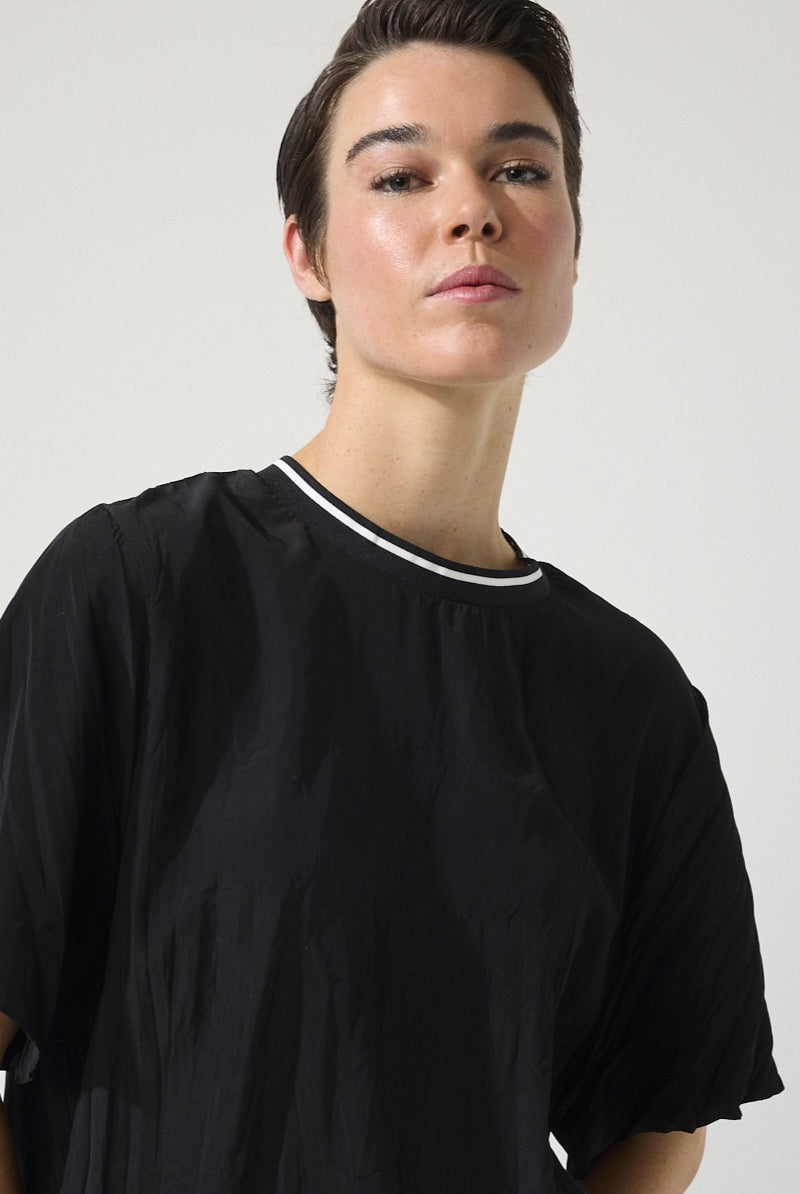 womens relaxed fit tee with crinkle texture contrast crew neck black worn by model close up