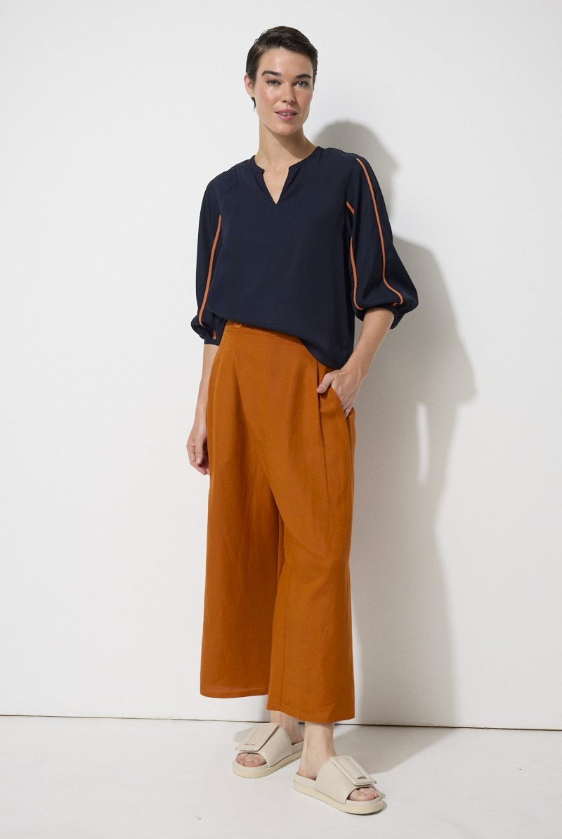 relaxed fit linen blend pant in rust worn by model