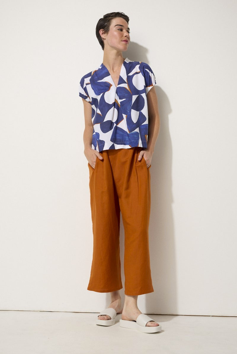 relaxed fit linen blend pant in rust worn by model