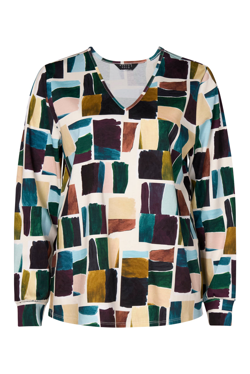 Multicolored mosaic patterned shirt on a white background