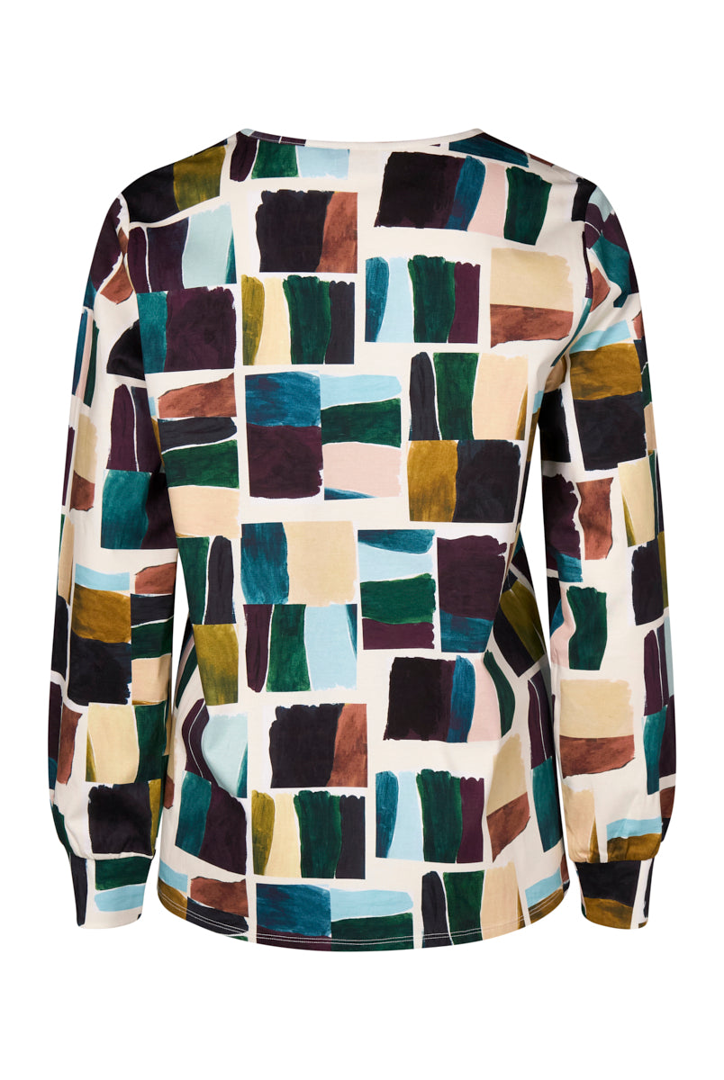 Colorful patterned shirt with geometric design on a white background back angle
