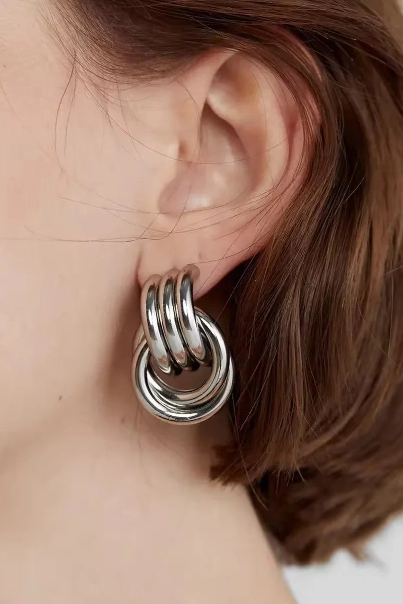 interloop silver earrings on ear