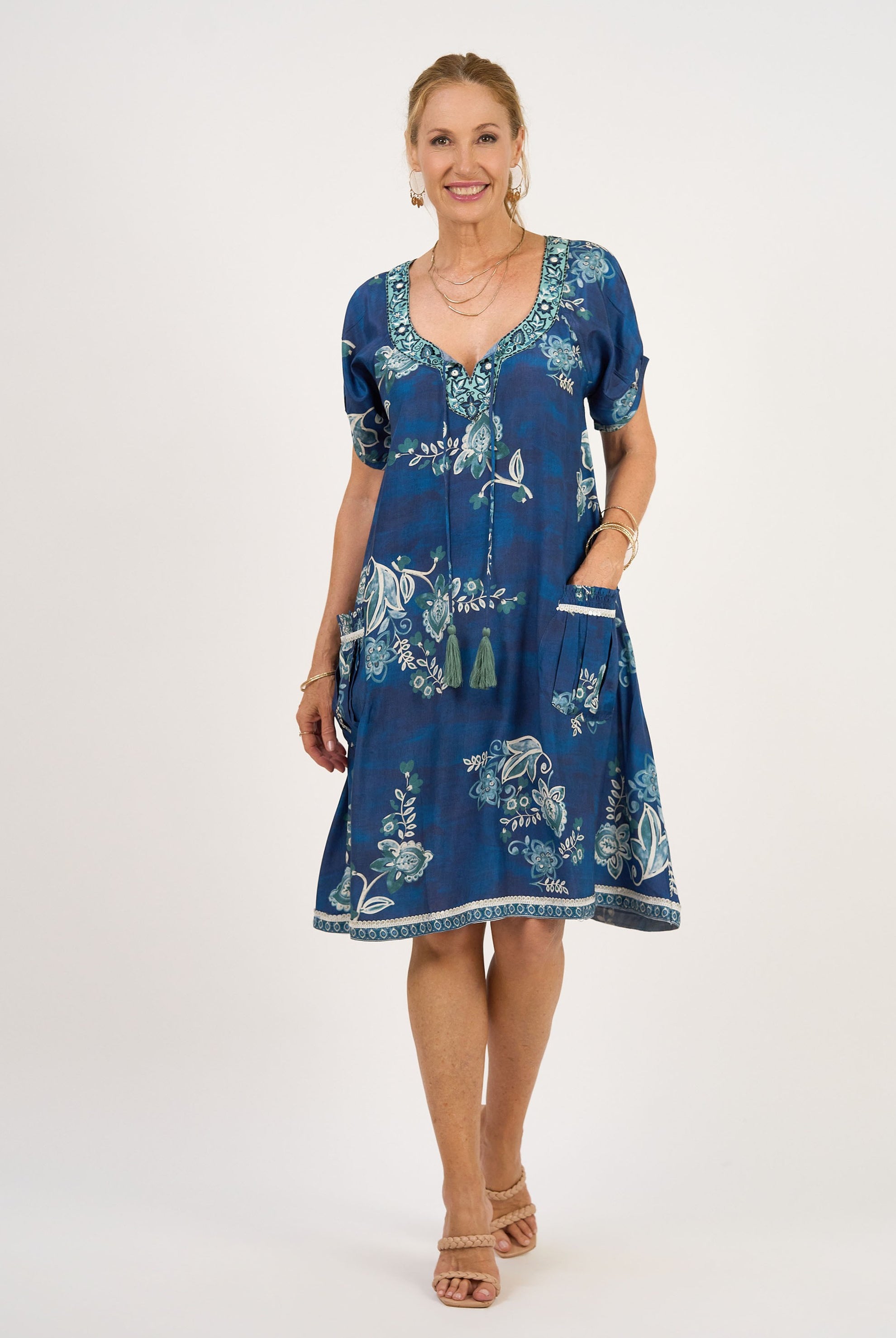 midi dress blue print with tassle tie neck worn by model