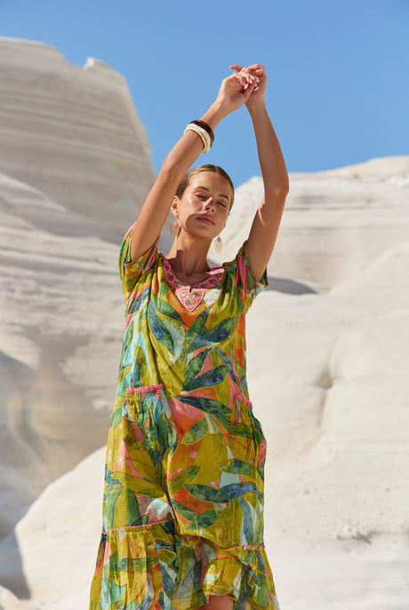 womens green multi leaf print midi dress worn by model outdoor campaign