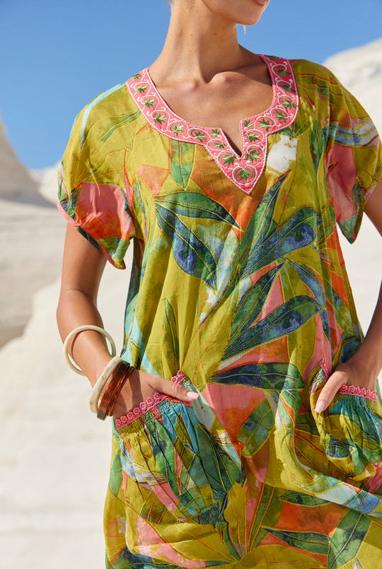 womens green multi leaf print midi dress worn by model outdoor campaign