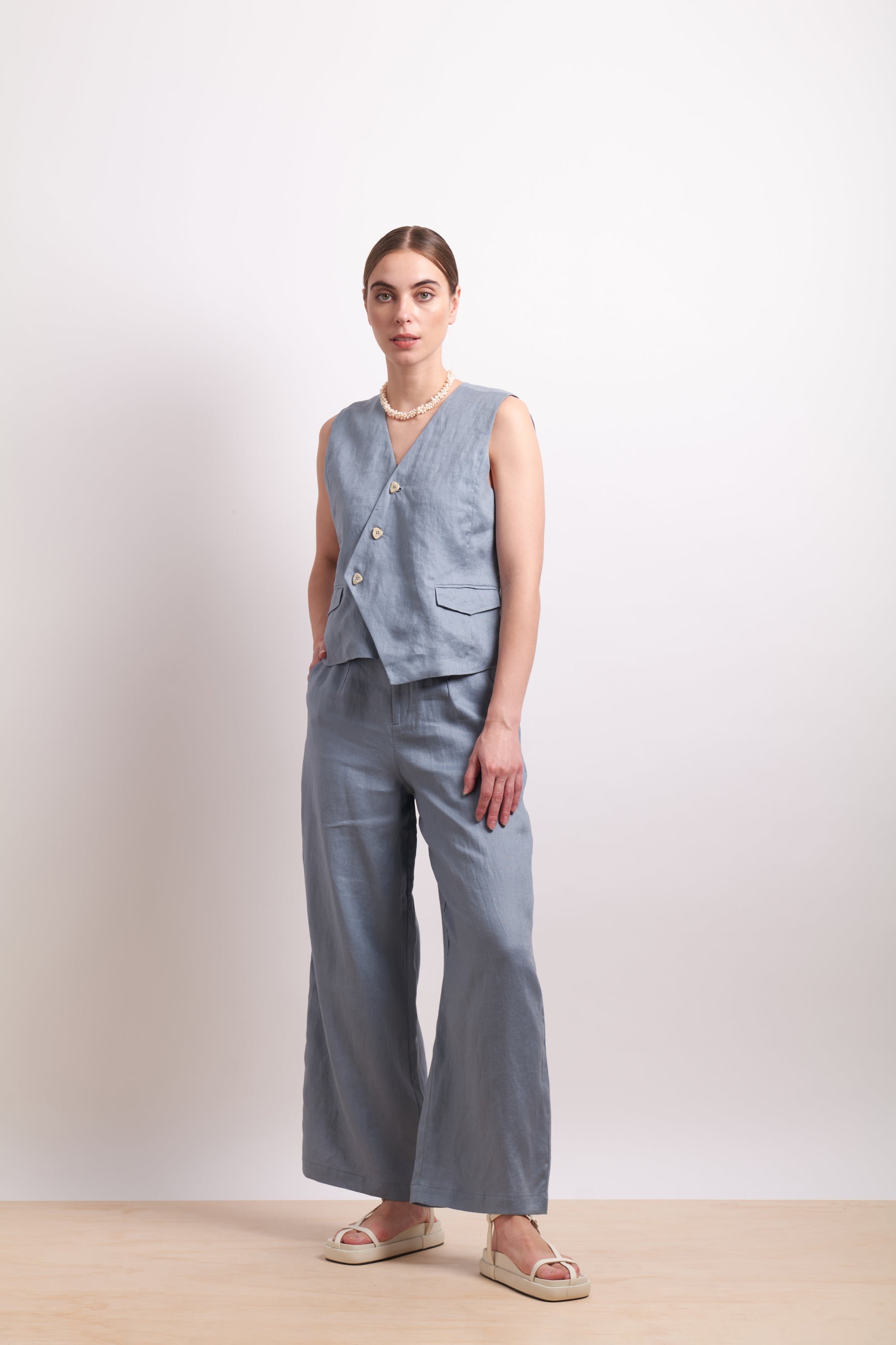 womens asymmertical button linen vest in light blue dove