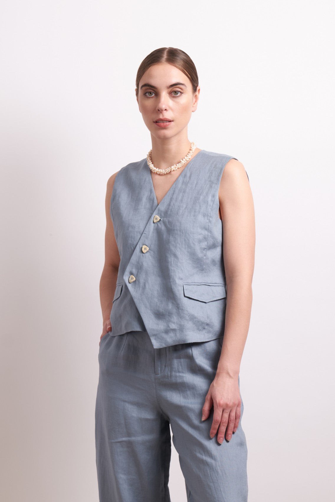 womens asymmertical button linen vest in light blue dove