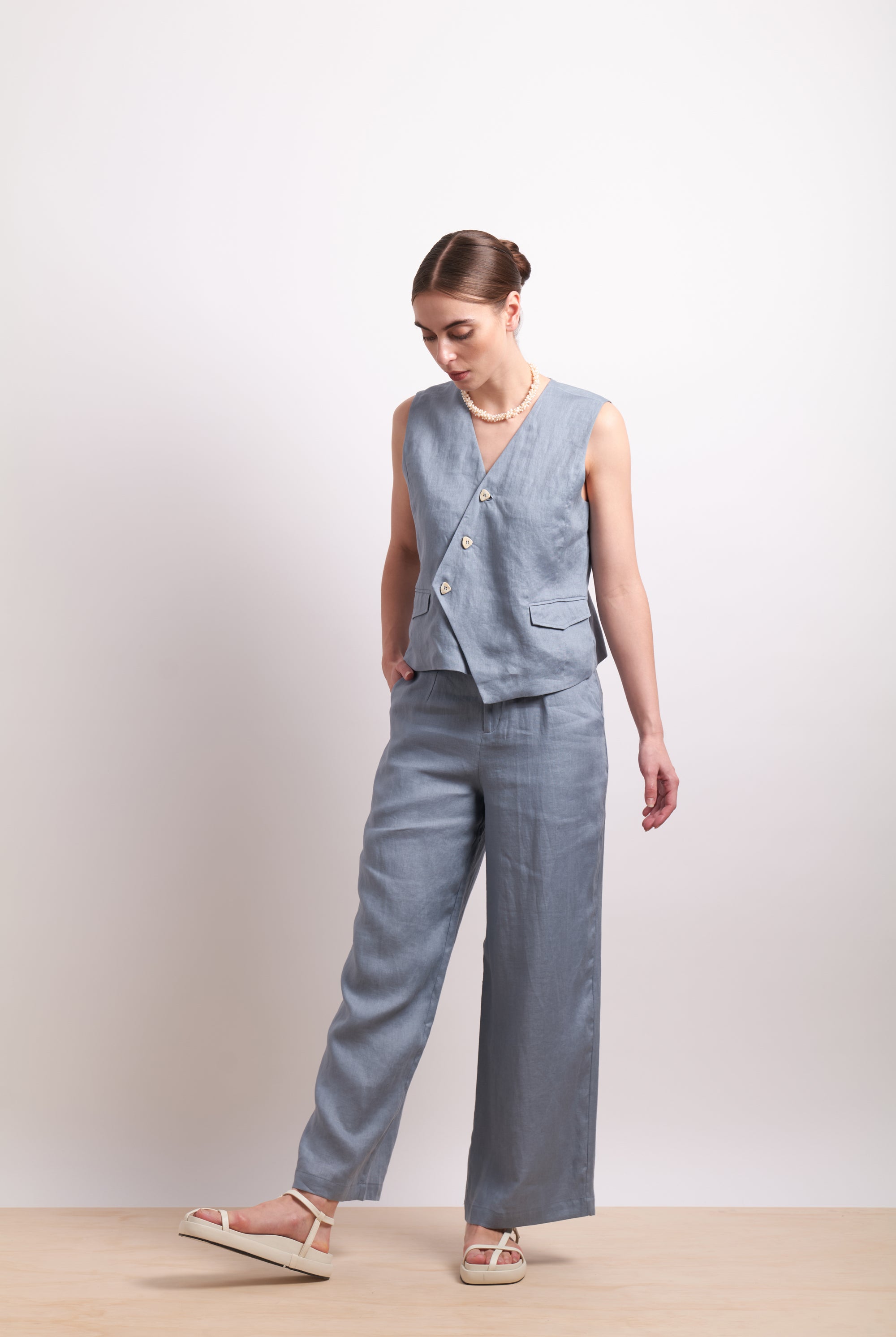 womens asymmertical button linen vest in light blue dove