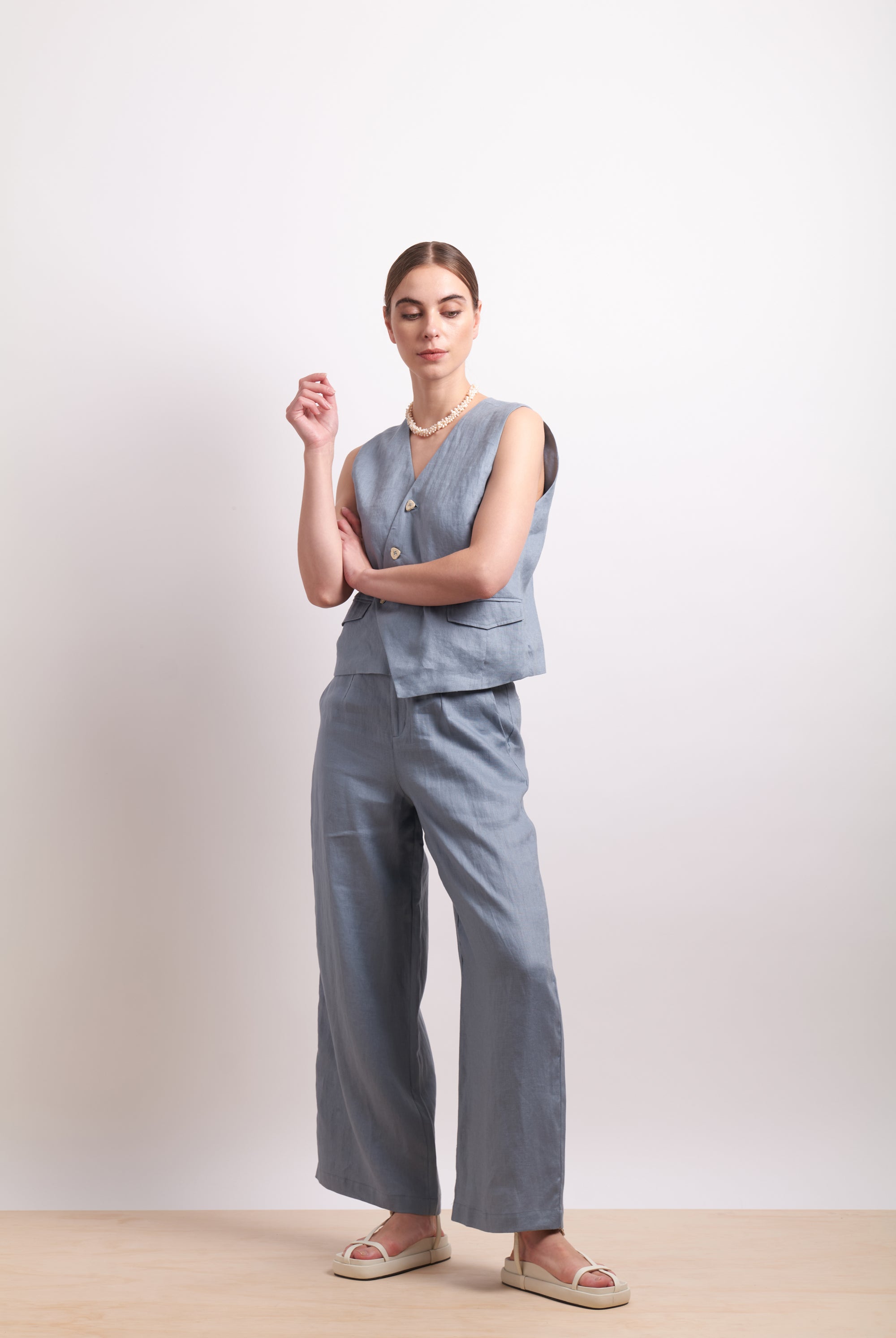womens asymmertical button linen vest in light blue dove