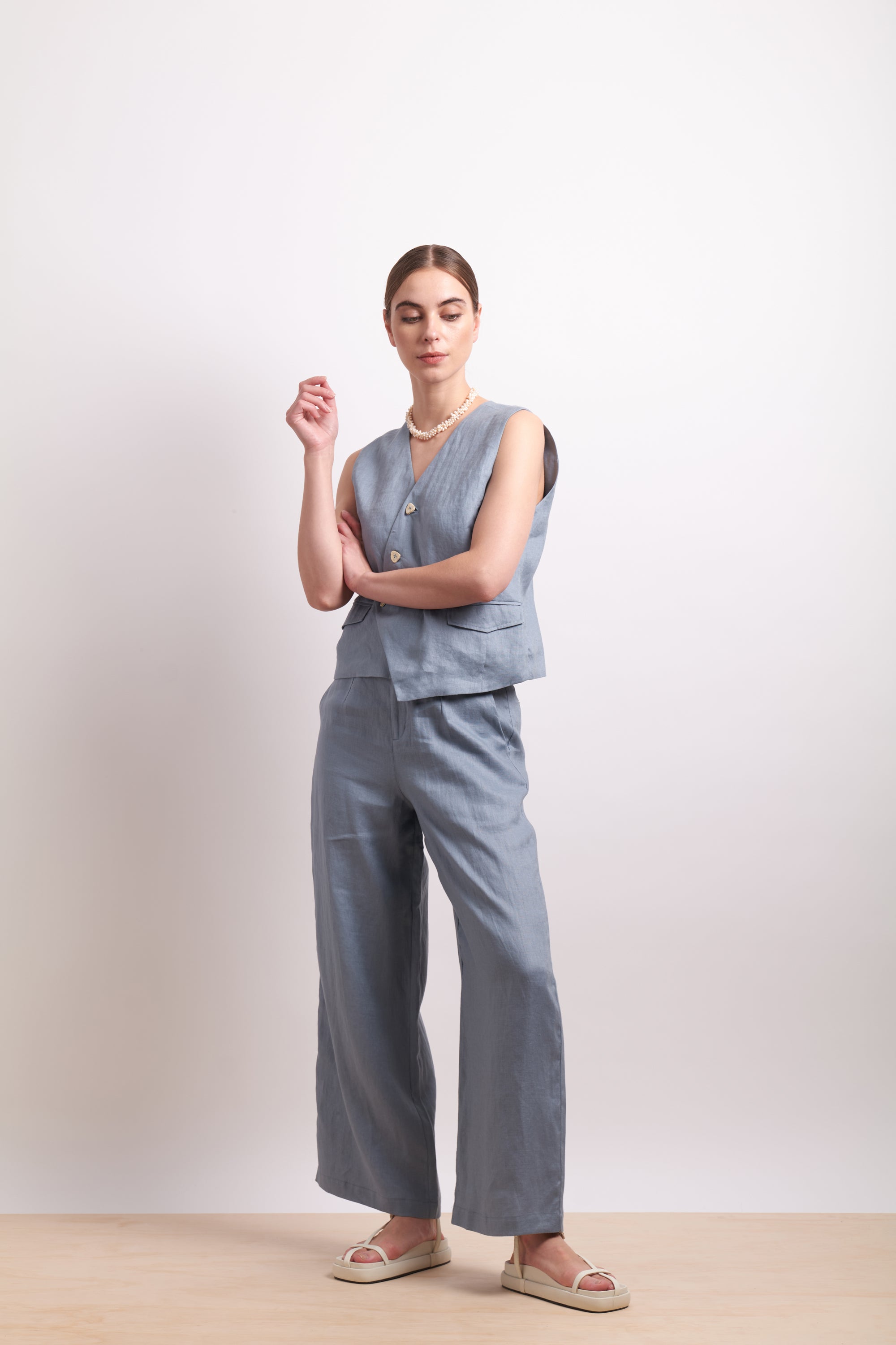 womens asymmertical button linen vest in light blue dove