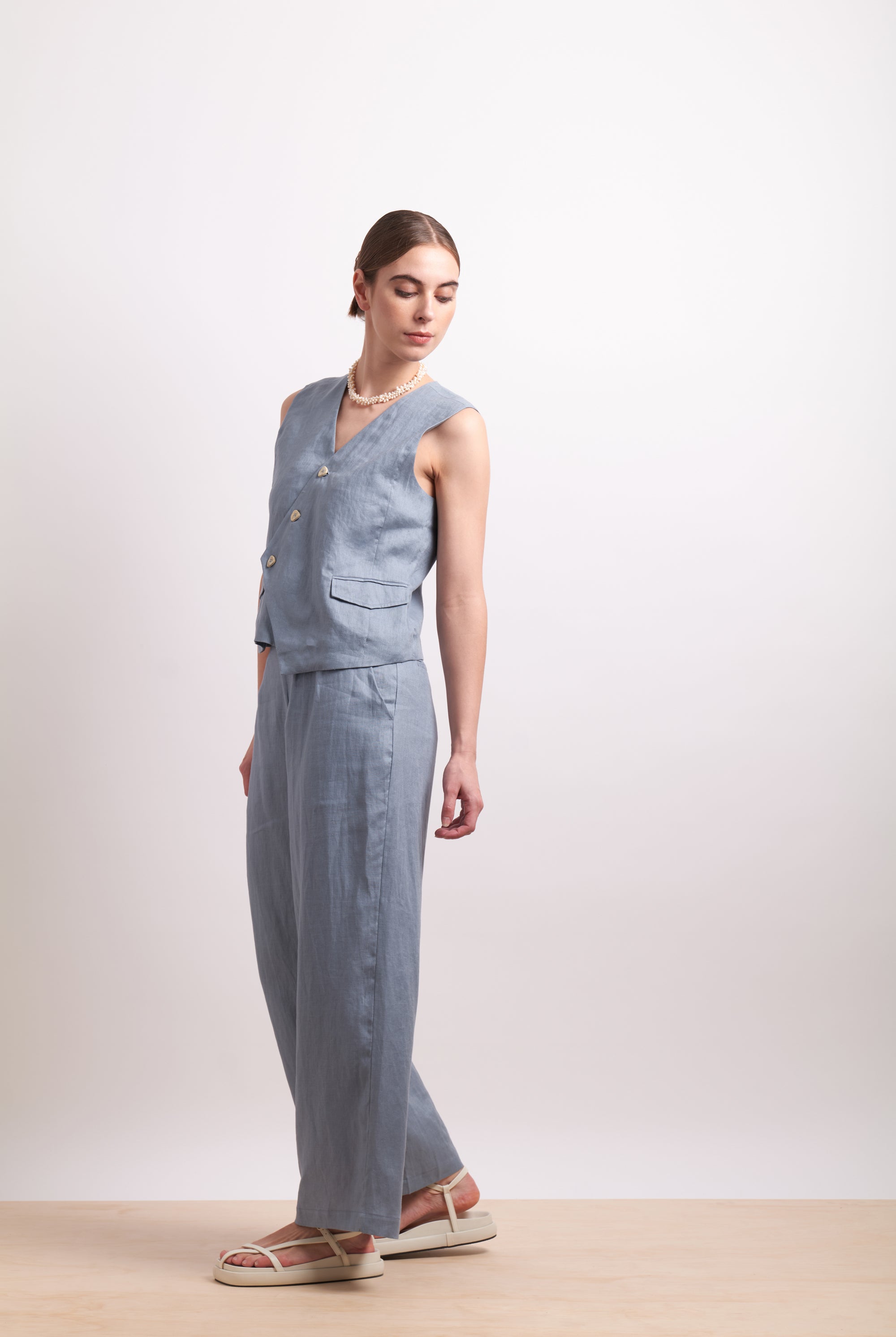 womens asymmertical button linen vest in light blue dove