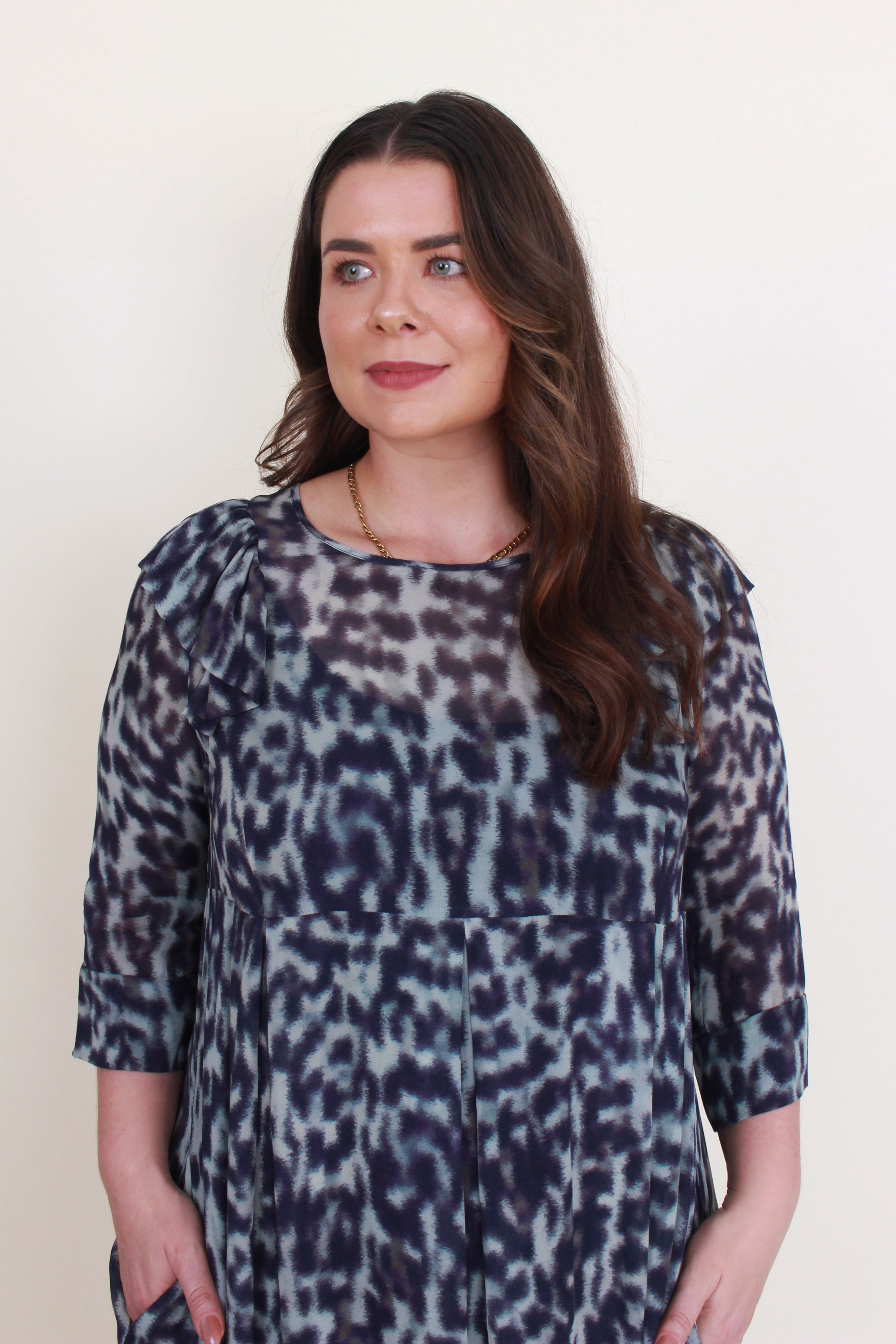 womens midi dress with pleats and half sleeve in blue jungle print worn by model close up