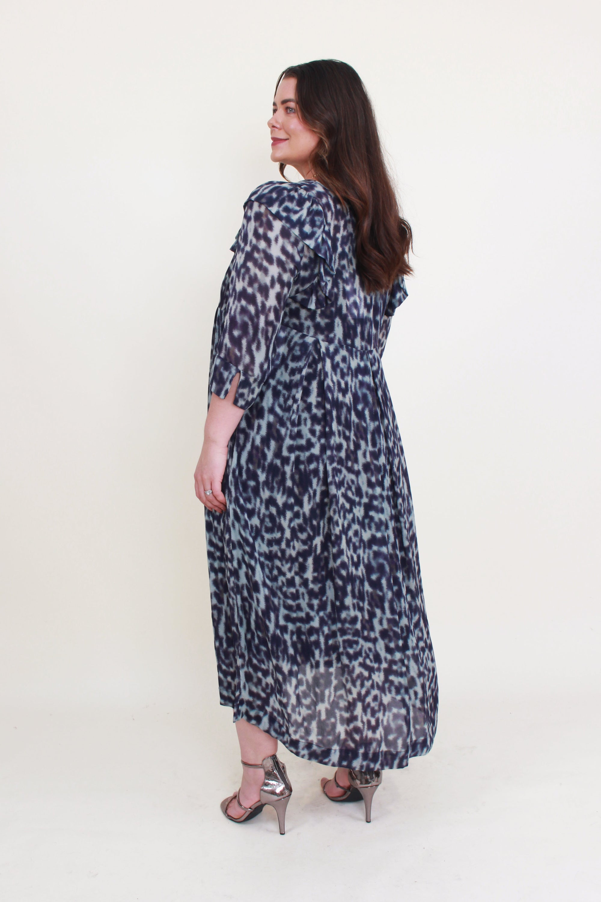 womens midi dress with pleats and half sleeve in blue jungle print worn by model back view