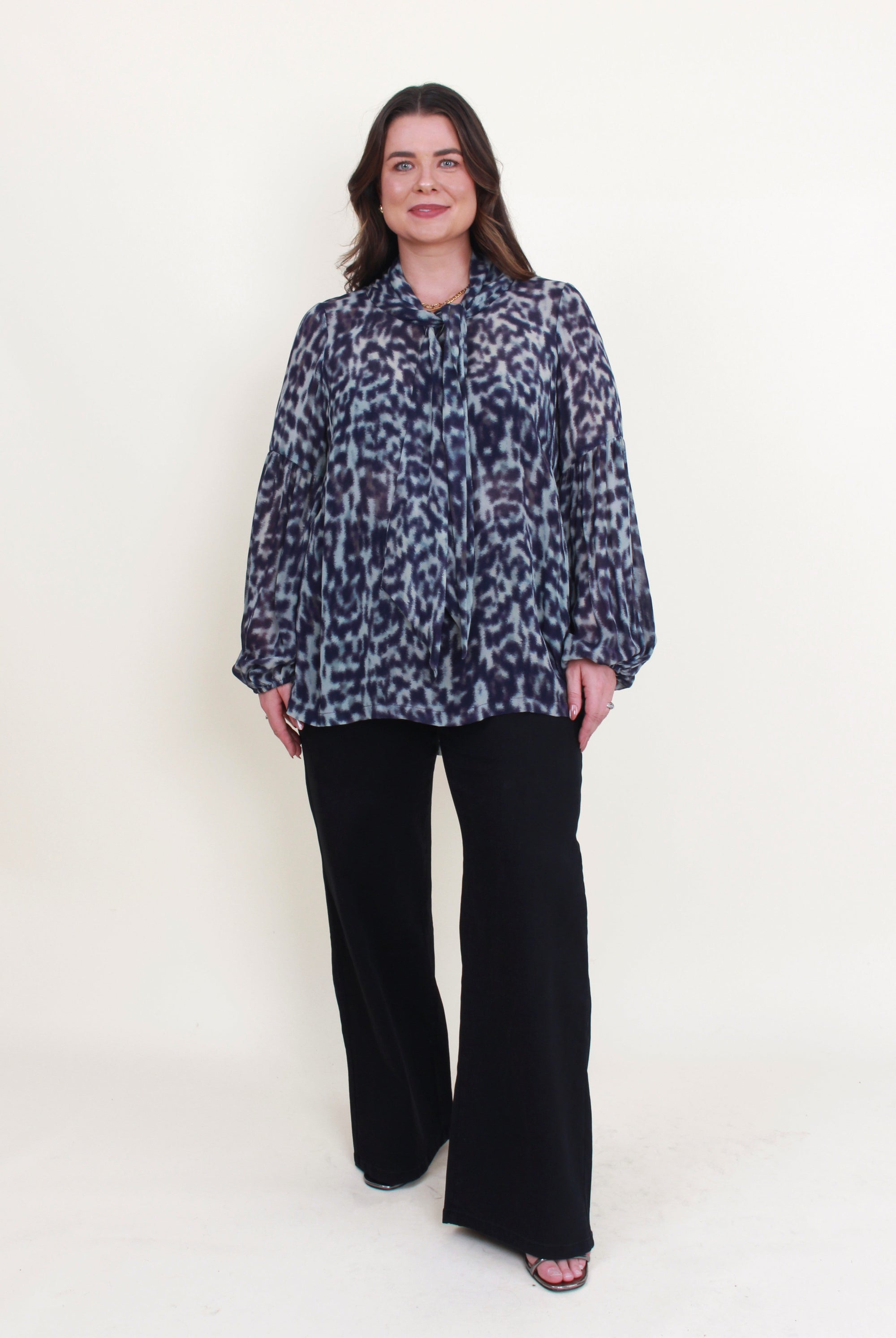 womens blouse long sleeve semi sheer in jungle blue worn by model