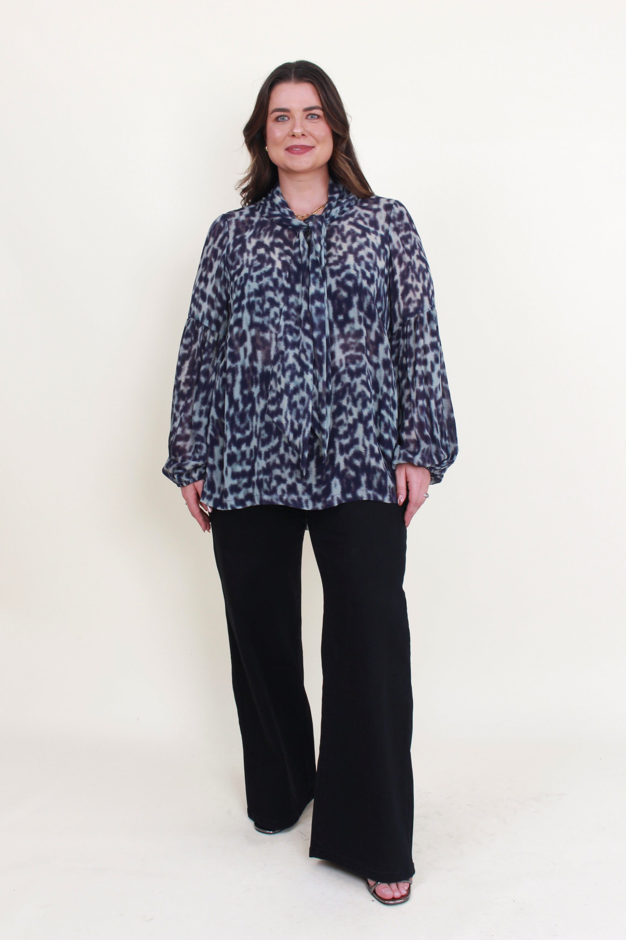 womens blouse long sleeve semi sheer in jungle blue worn by model