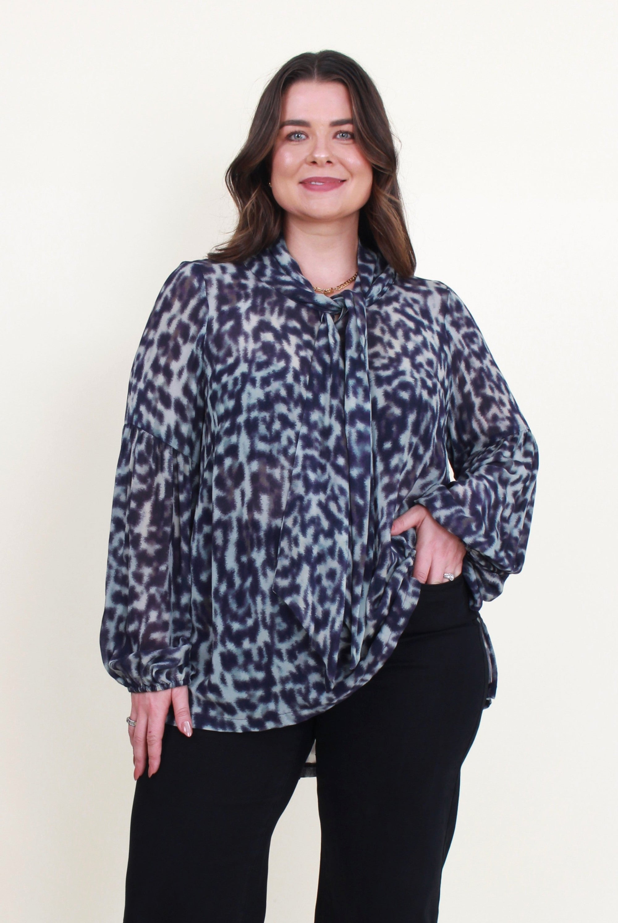 womens blouse long sleeve semi sheer in jungle blue worn by model