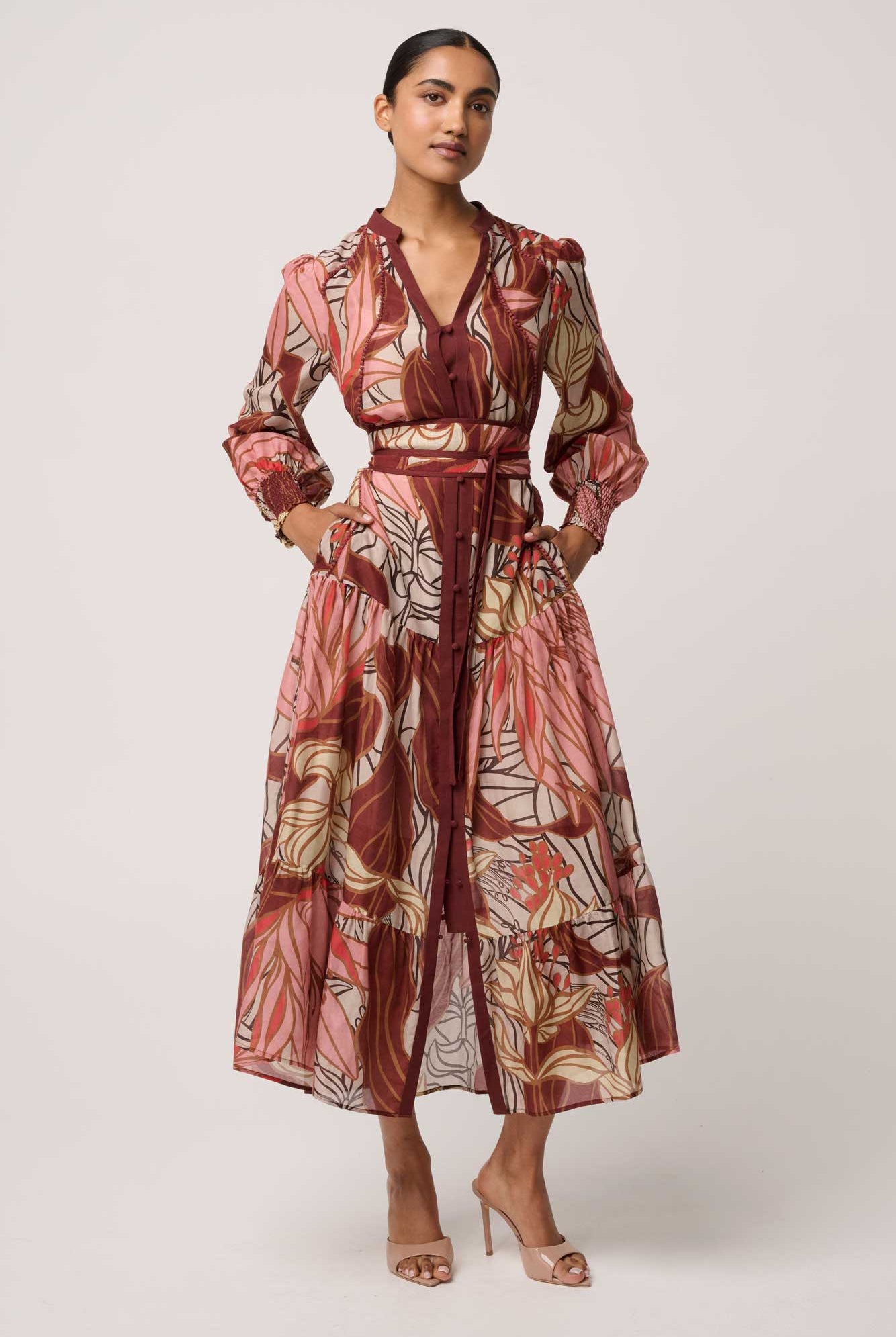 Woman wearing a floral dress on a white background