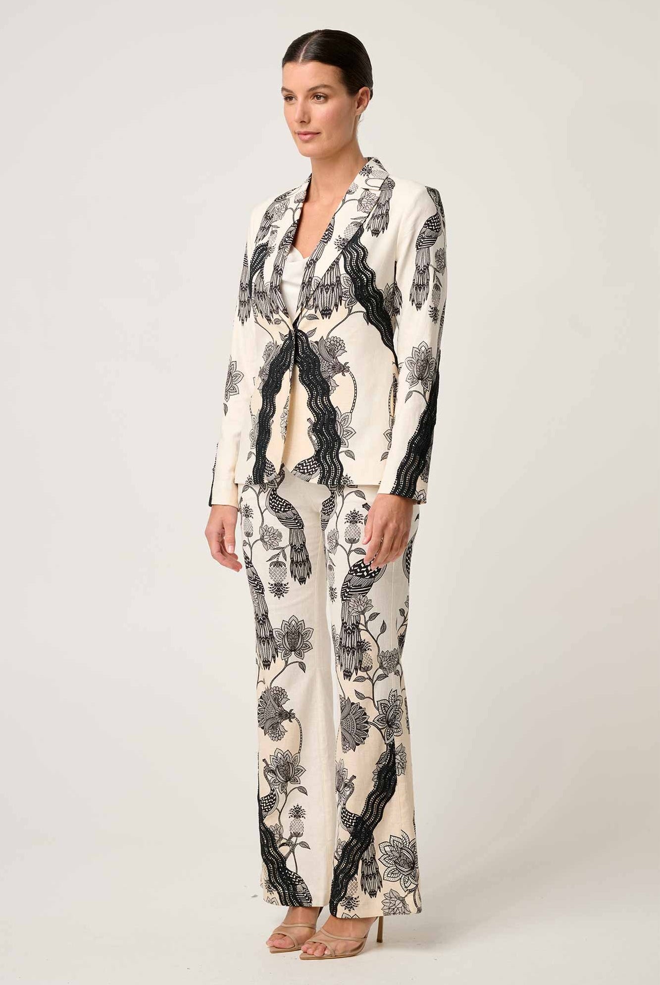 womens cream with black linework print blazer and pant worn by model side view