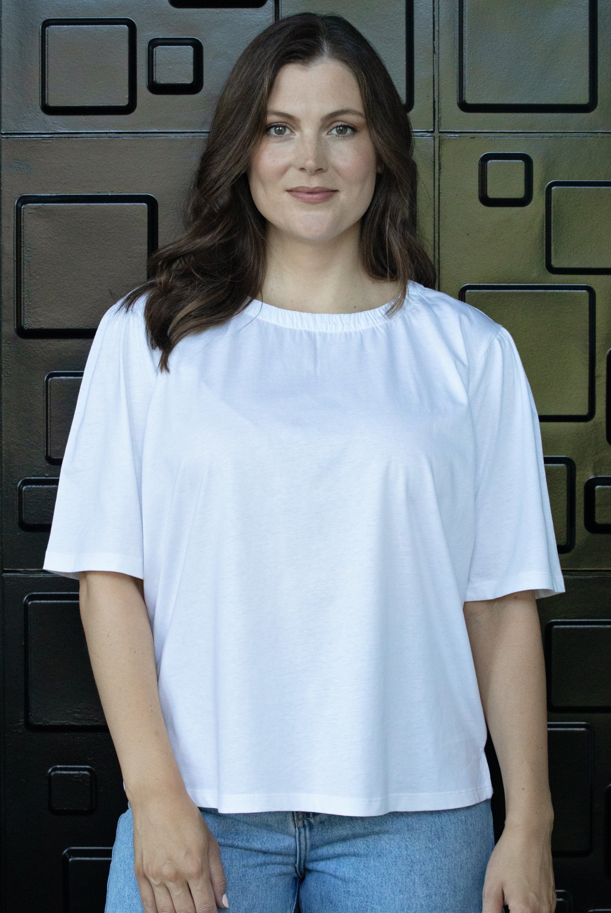 womens plain white tee with gather neckline worn by model