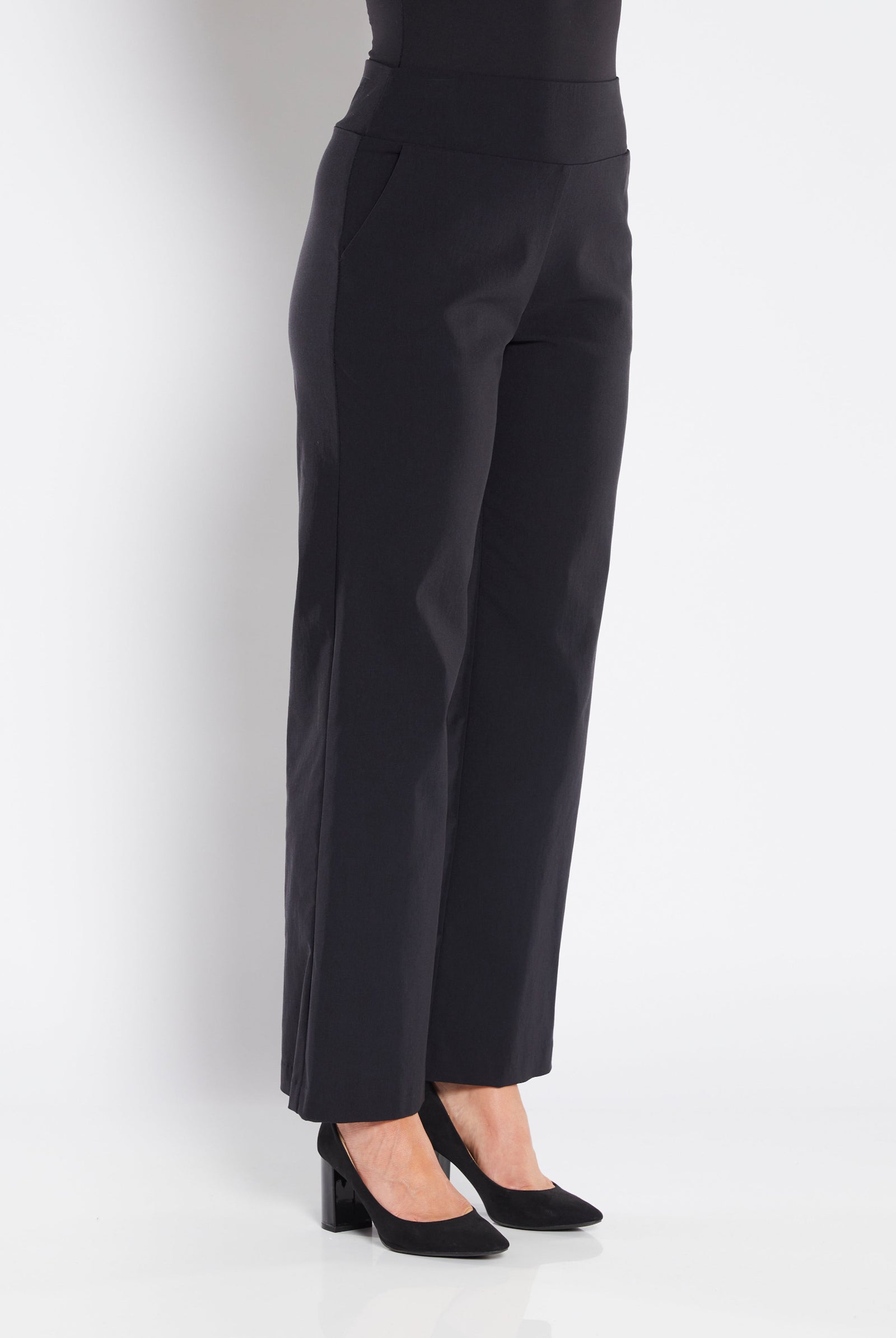 Black pants worn by a person on a white background