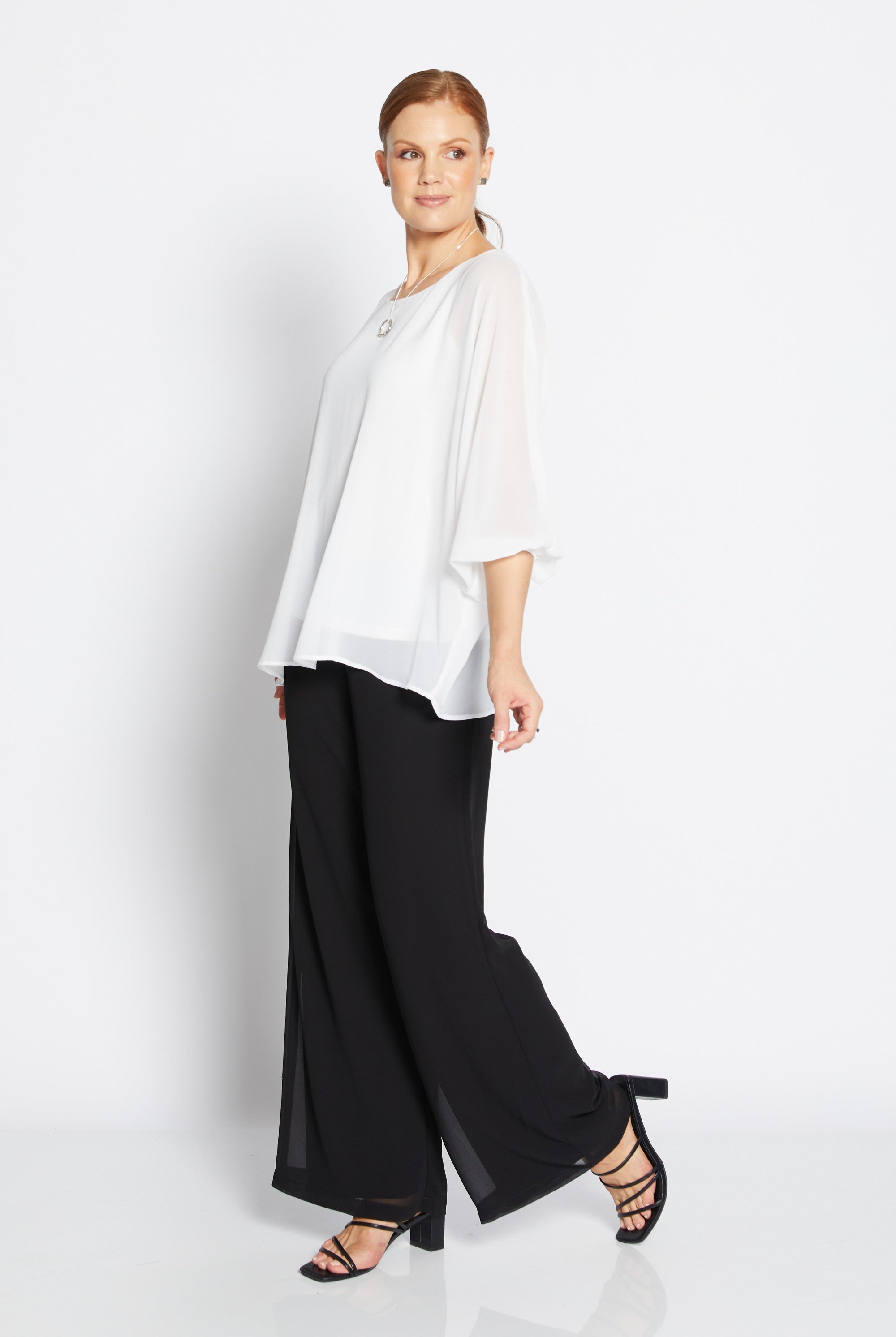 womens chiffon overlay wide leg pants black with white blouse worn by model