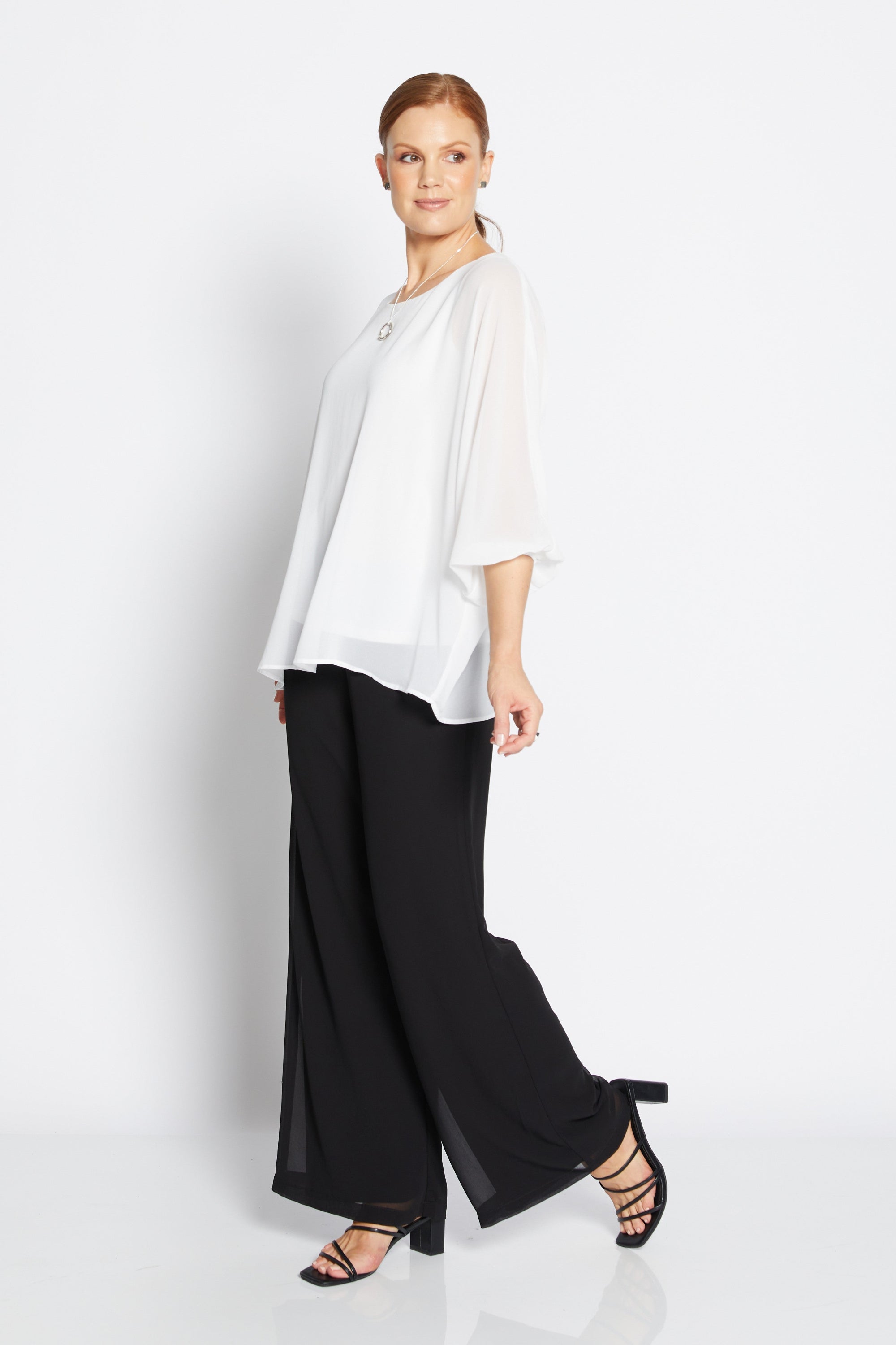 womens chiffon overlay wide leg pants black with white blouse worn by model