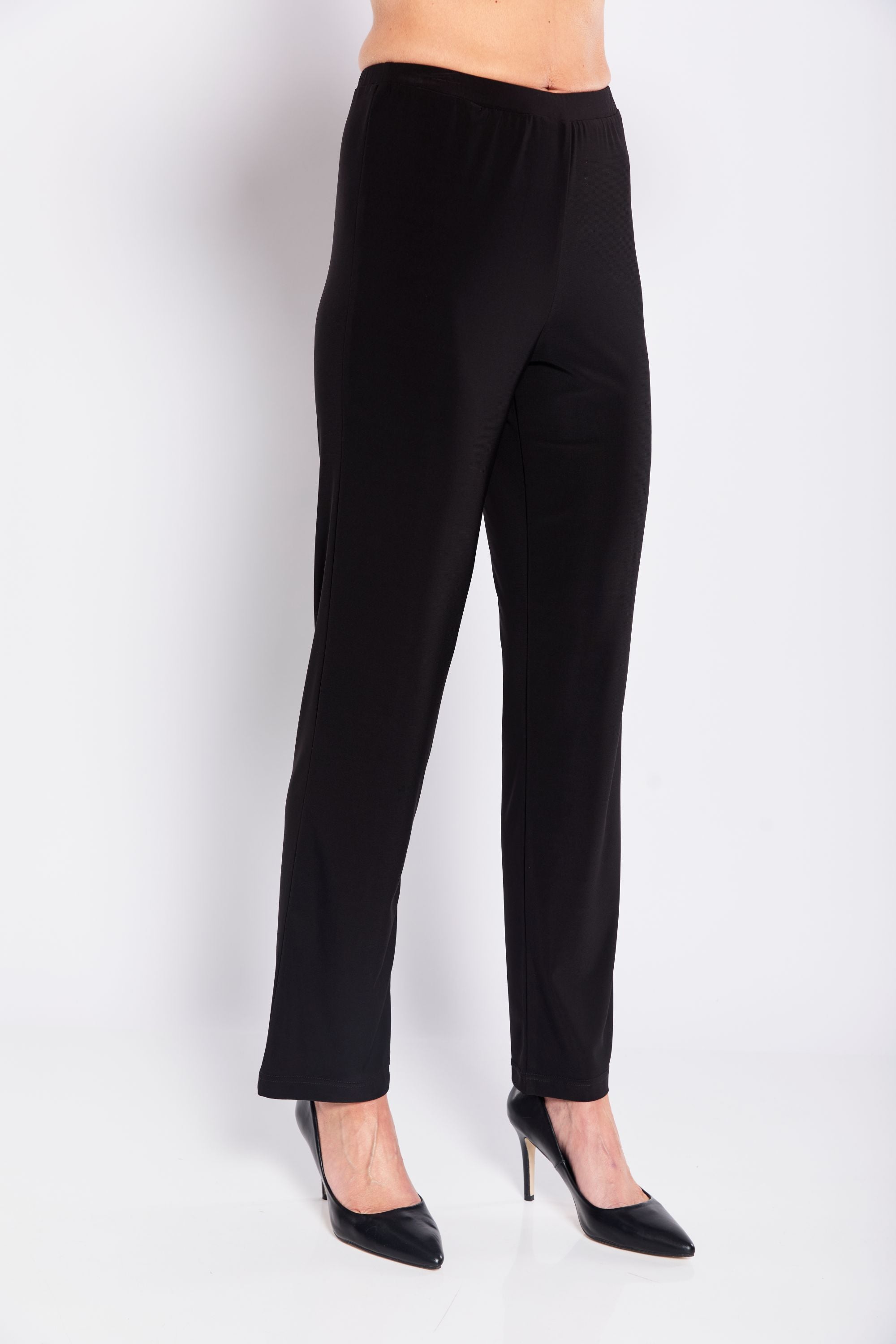 Black pants worn by a person on a white background