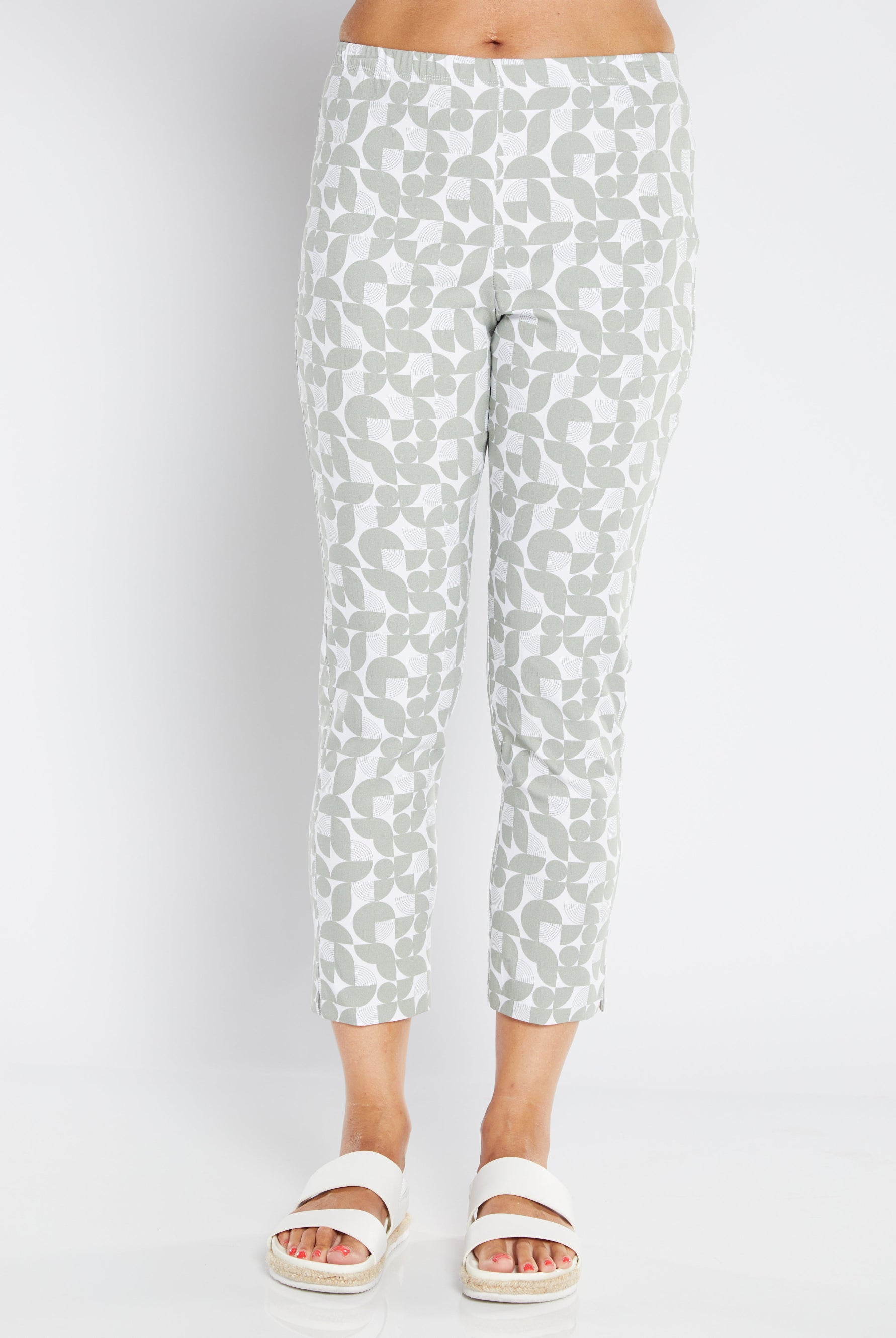 White pants with a subtle pattern worn by a person on a white background