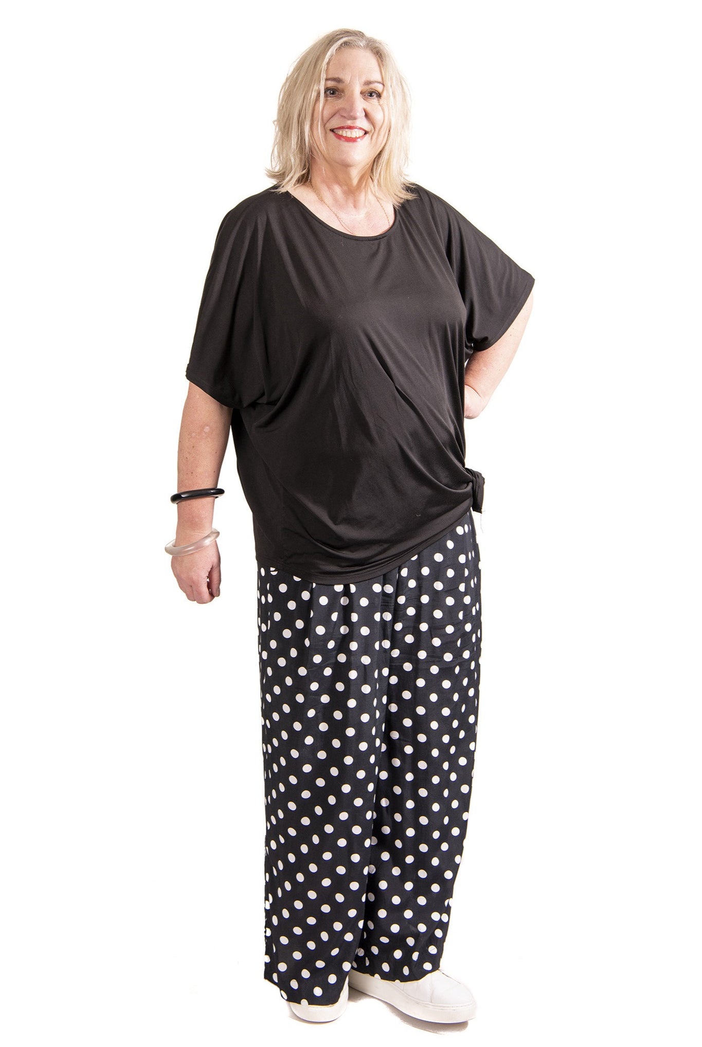 womens wide leg black white spot pant and black top worn by model