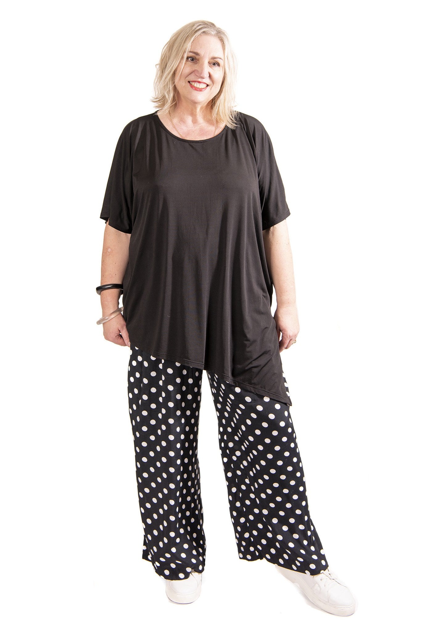 womens wide leg black white spot pant and black top worn by model