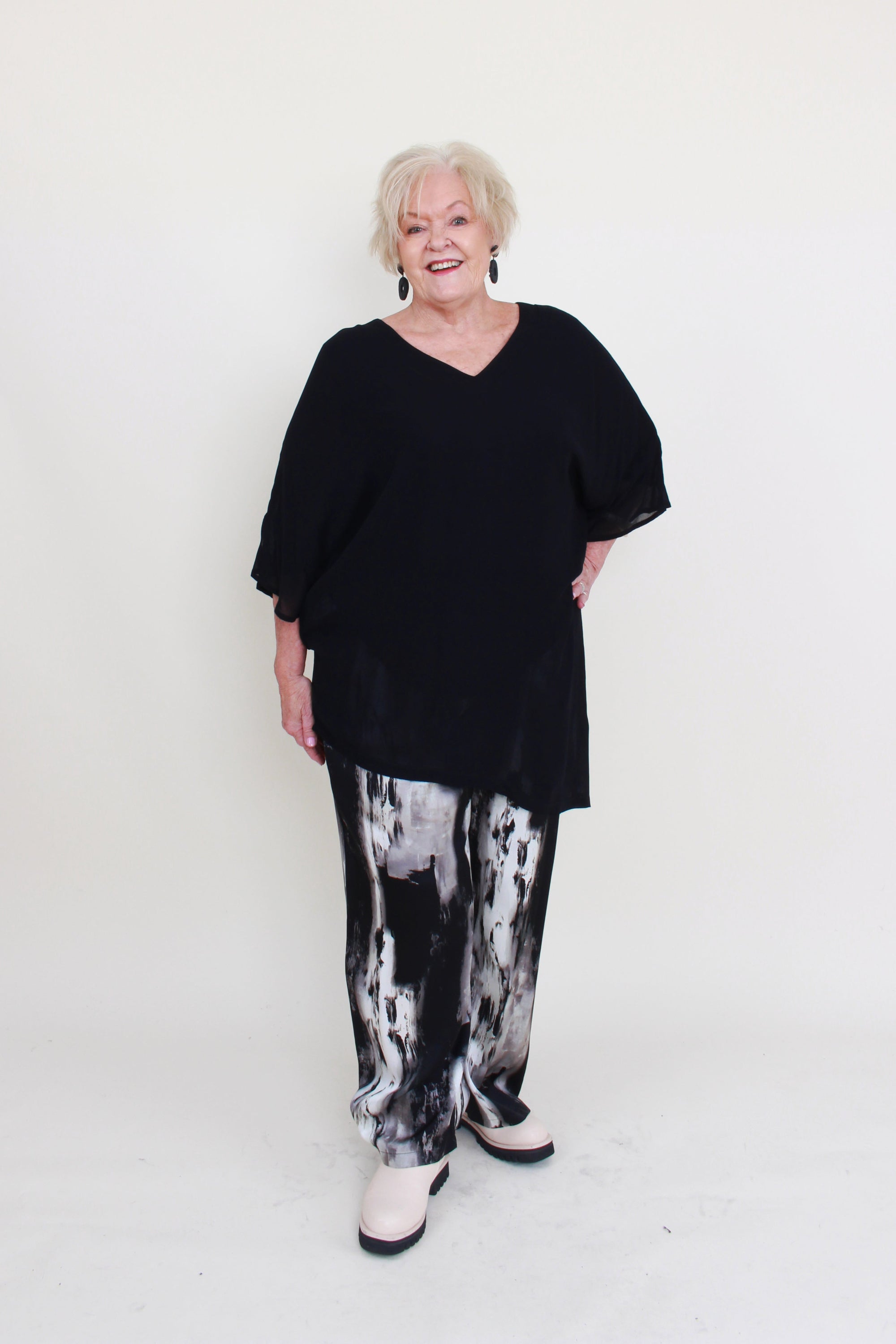 womens black semi sheer asymmetric reversible top black