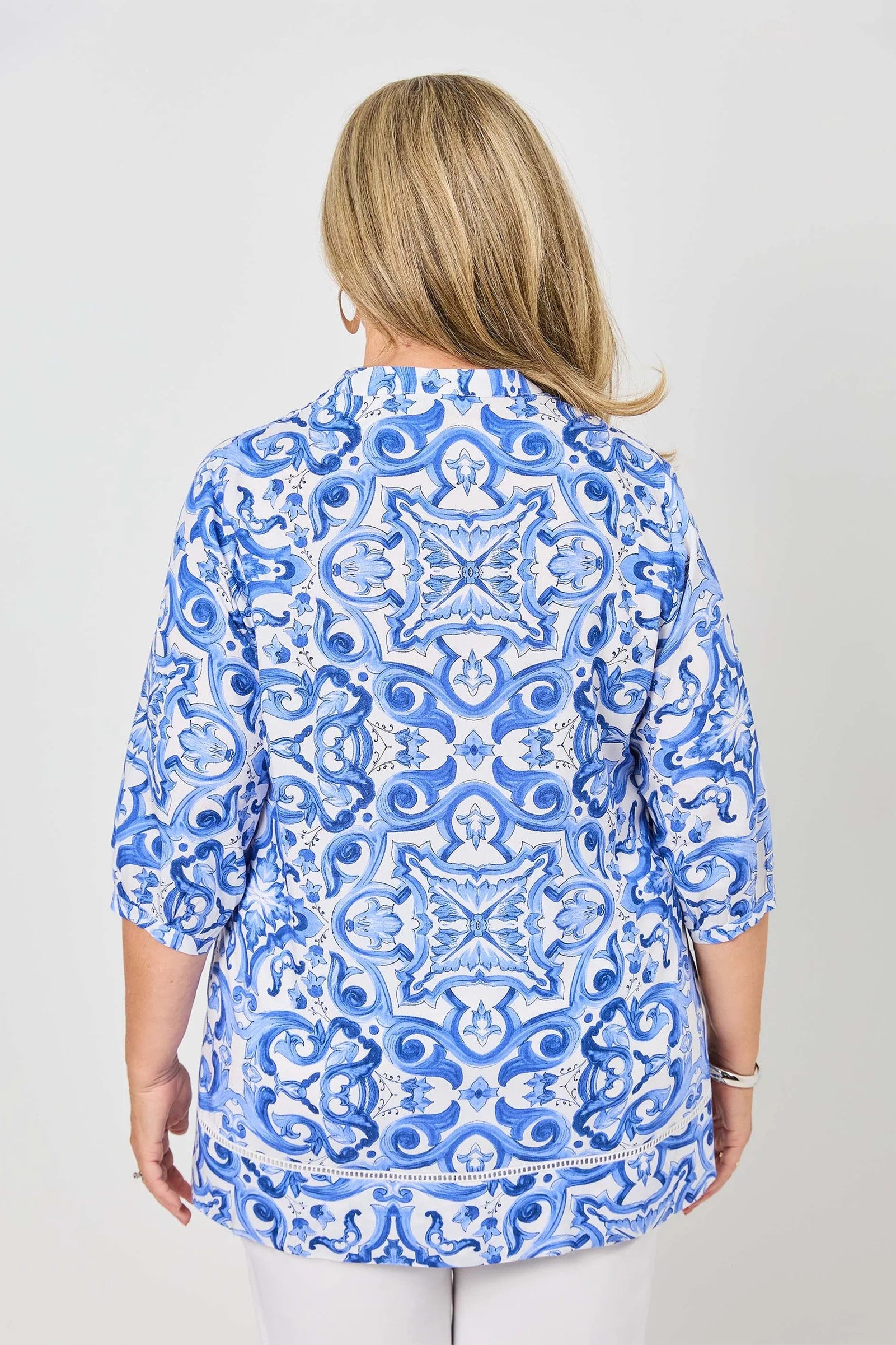 womens shirt blouse with blue white mediterranean print worn by model back view