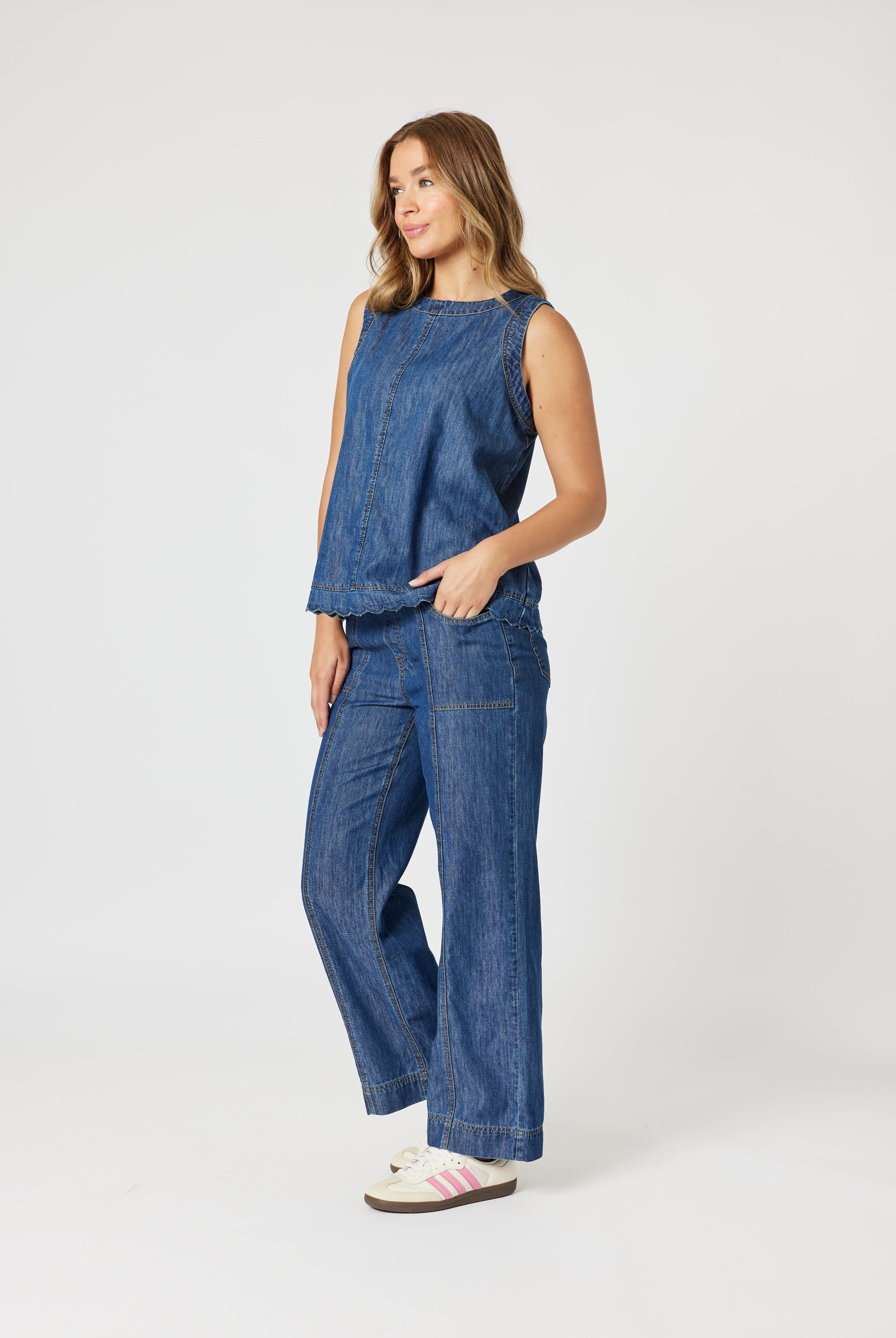 womens straight wide leg jean with top stitching mid wash worn by model side view