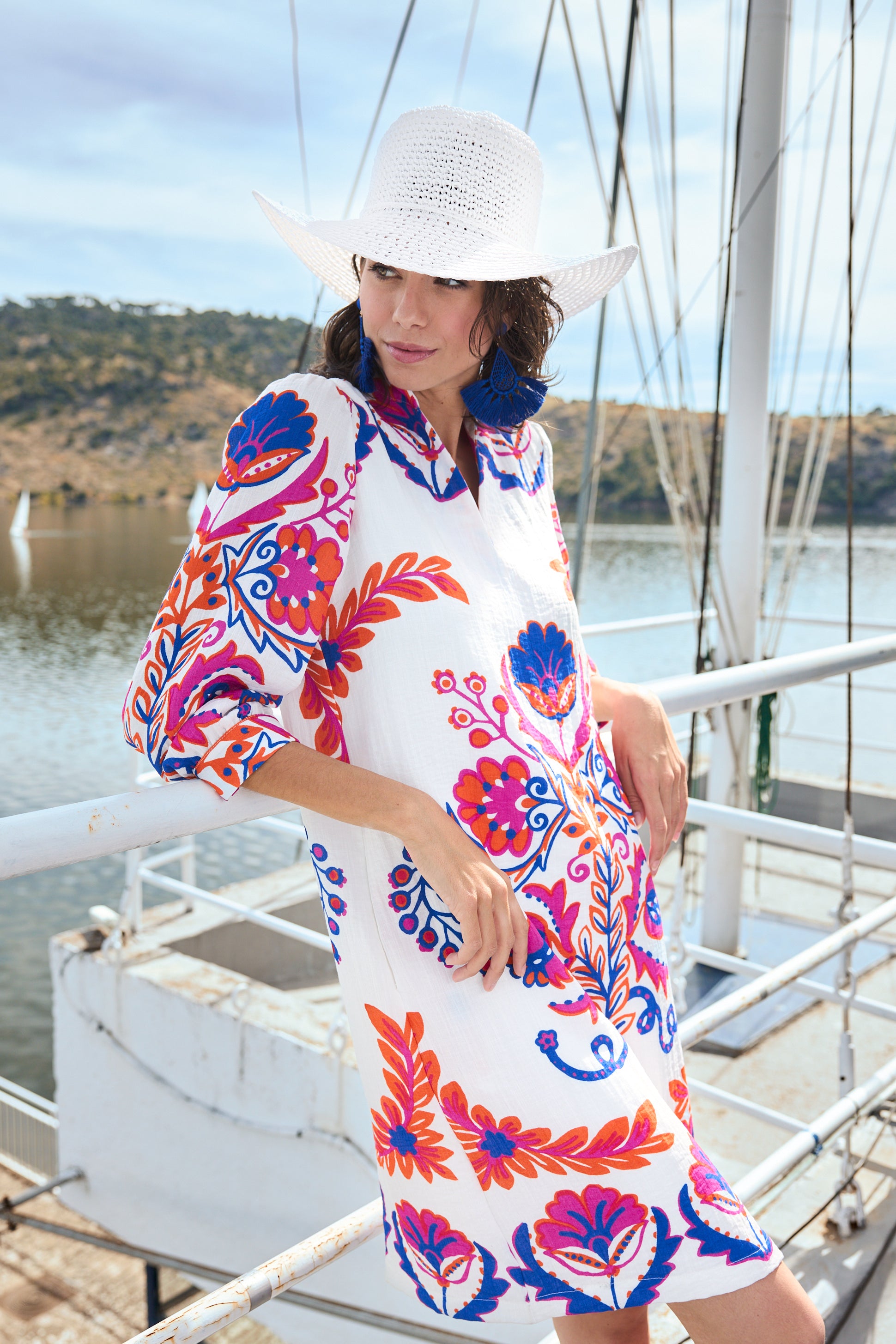 white with pink and blue print shift midi dress worn by model boat campaign