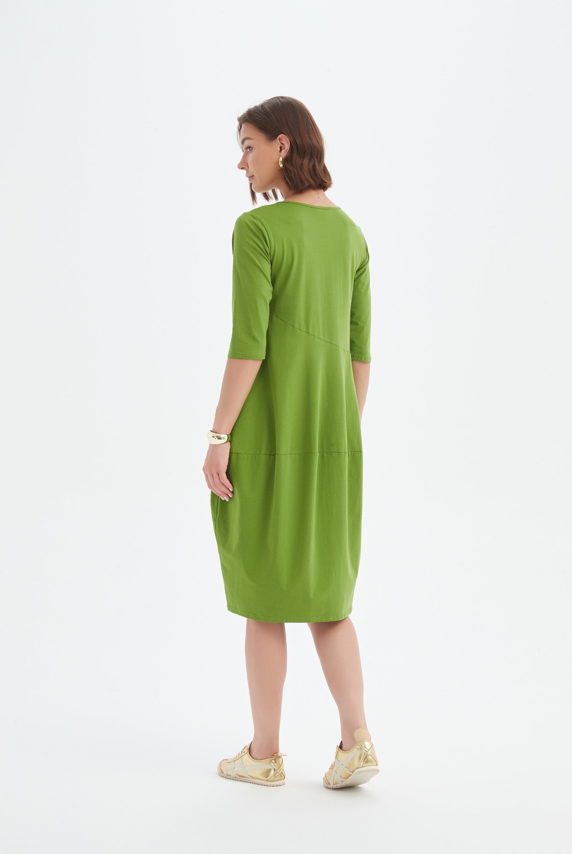 midi diagonal seam dress in green worn by model back view