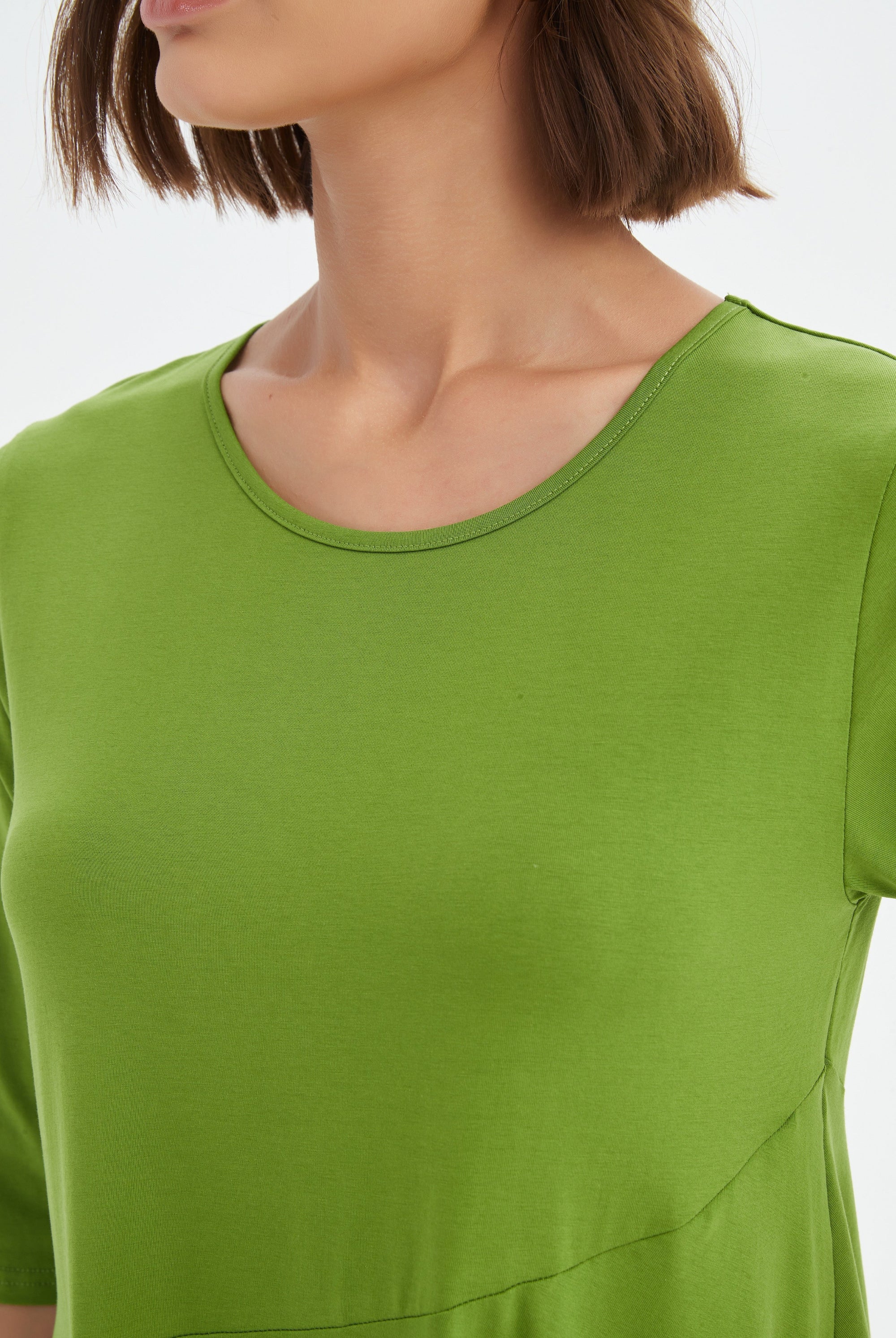 midi diagonal seam dress in green worn by model close up