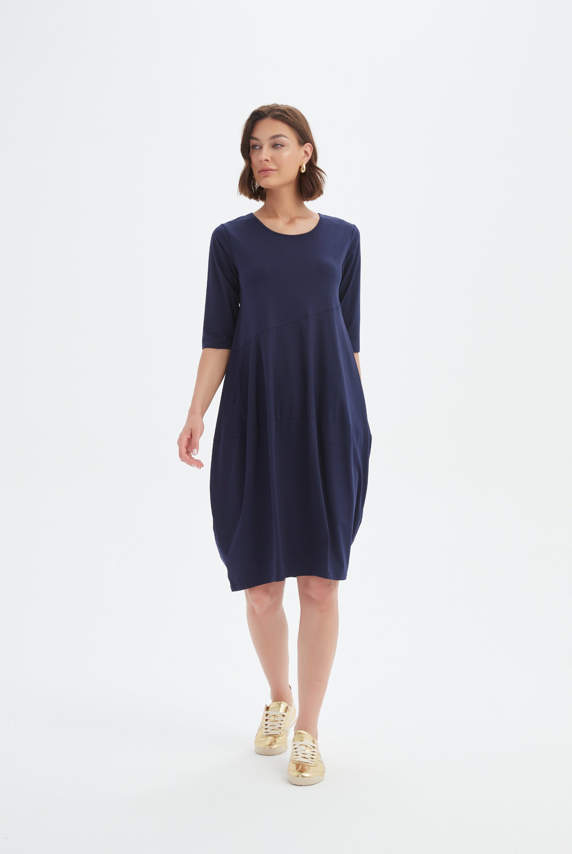 midi diagonal seam dress in navy worn by model