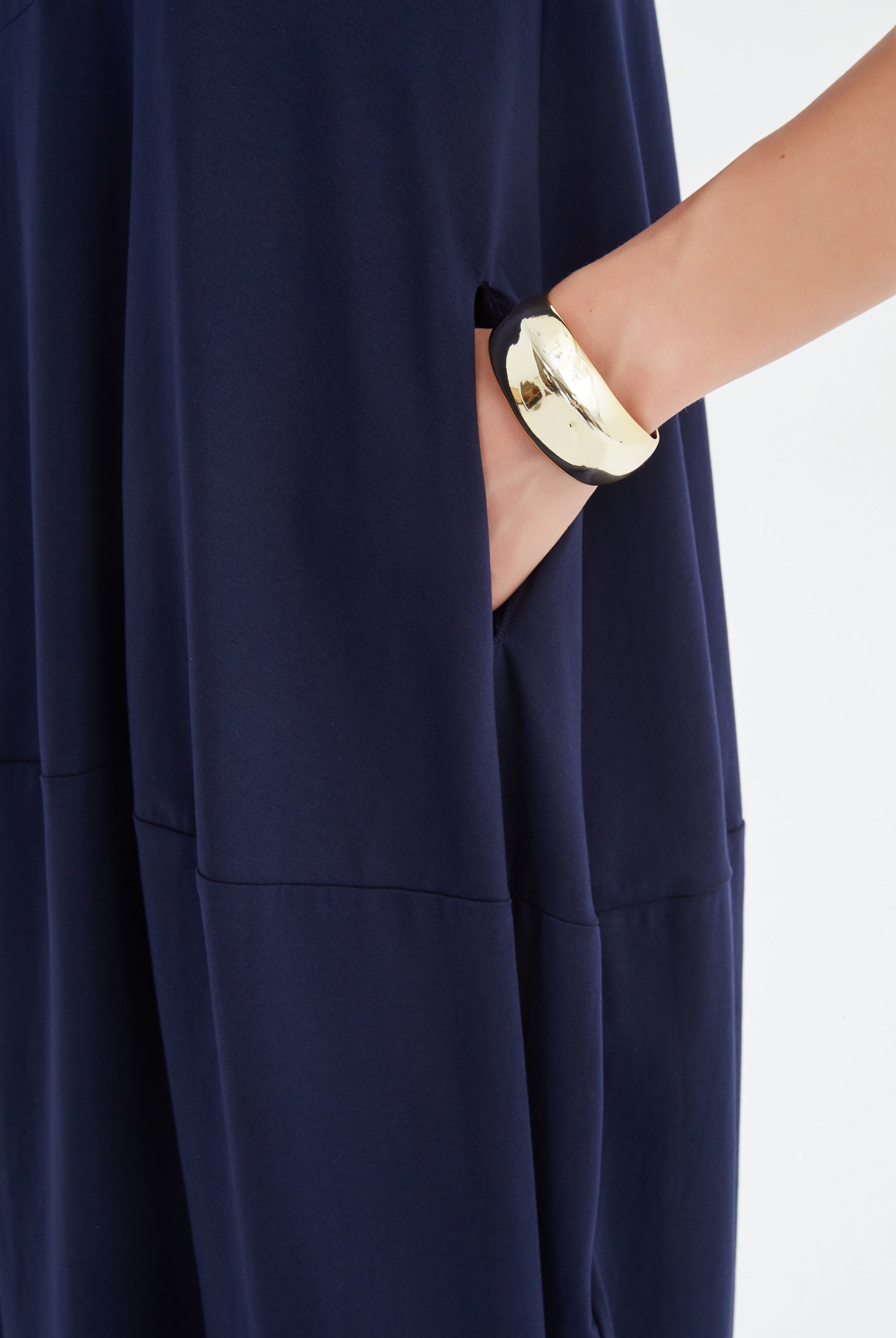 midi diagonal seam dress in navy worn by model close up