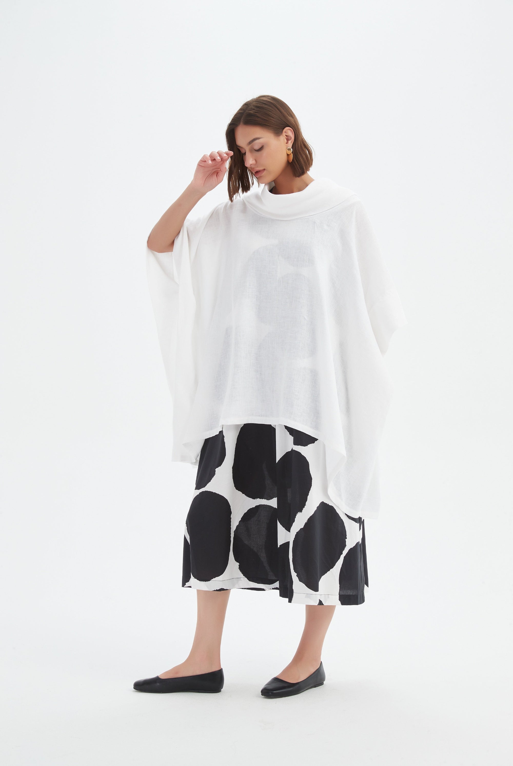 flowy waterfall poncho in white worn by model