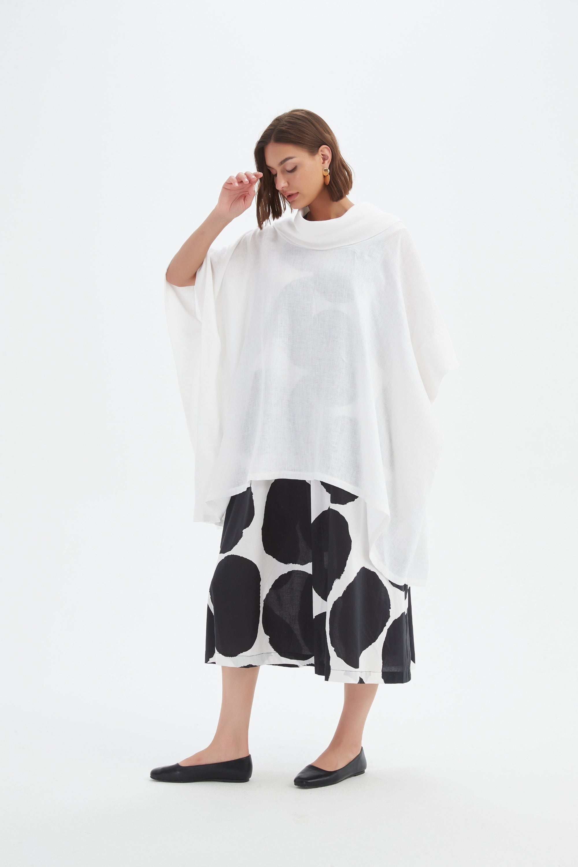 flowy waterfall poncho in white worn by model